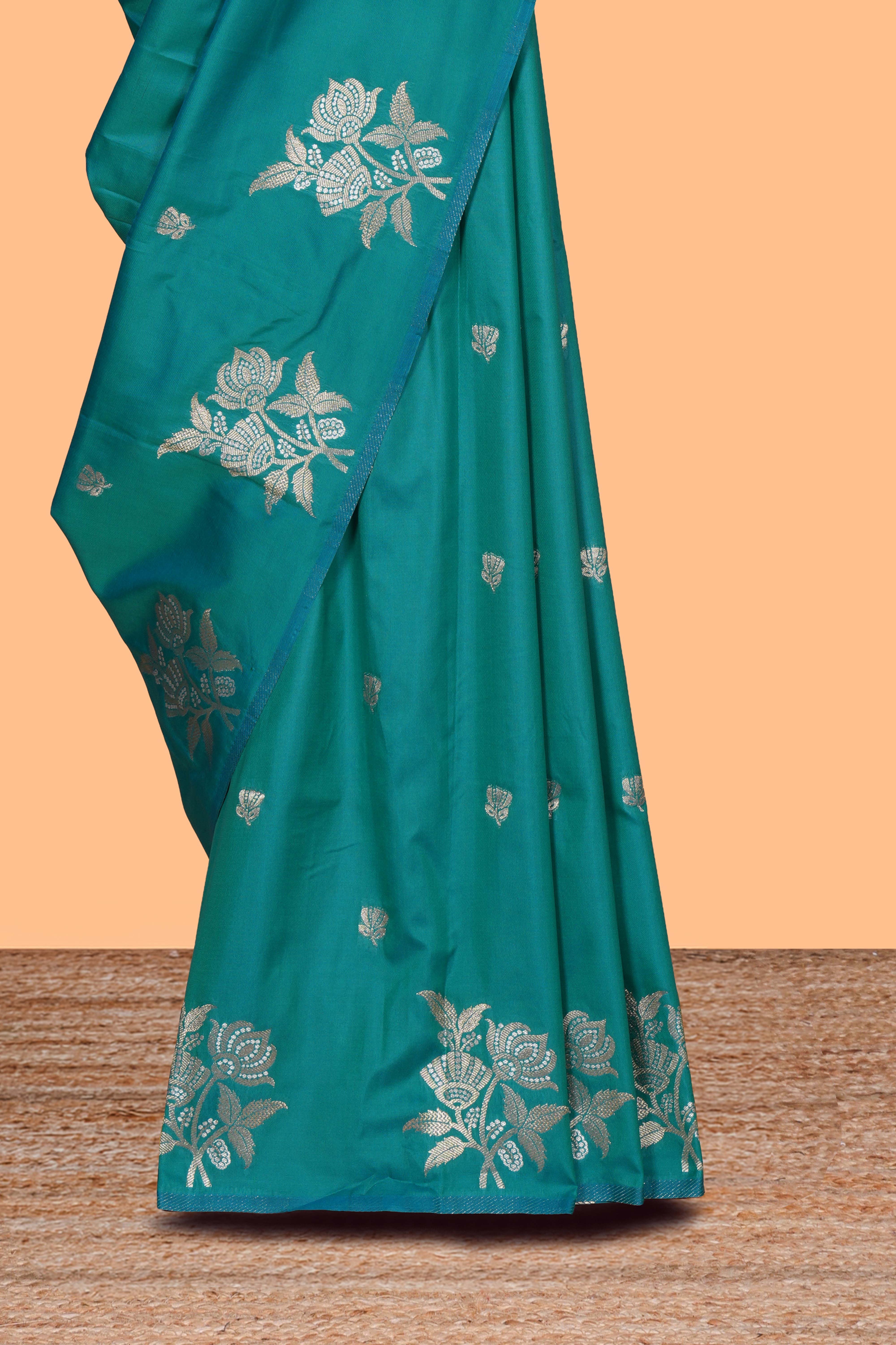 Borderless green floral zari motifs design semi soft silk saree with self pallu and matching blouse