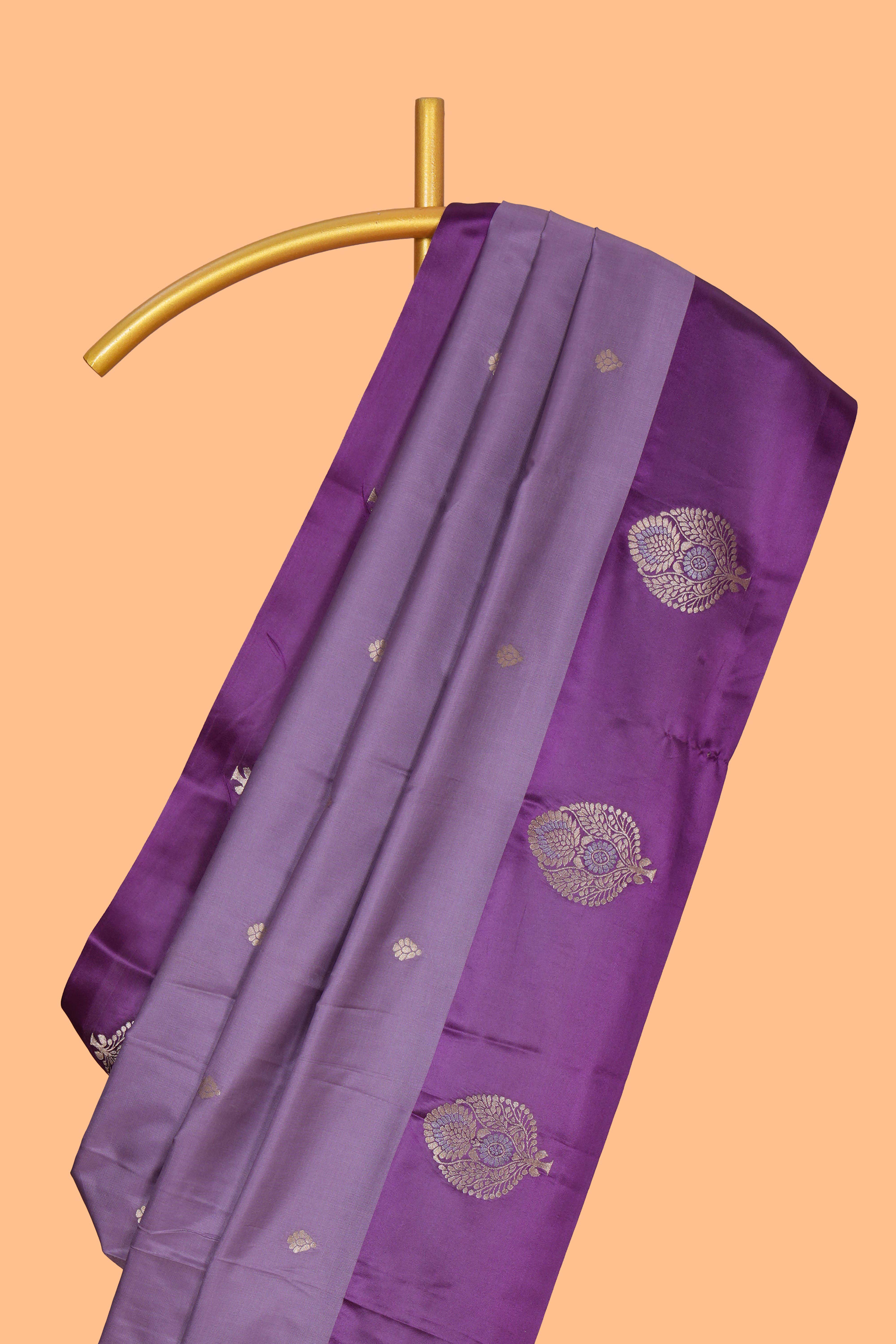 Lavender zari motifs design semi soft silk saree with contrast border and zari pallu