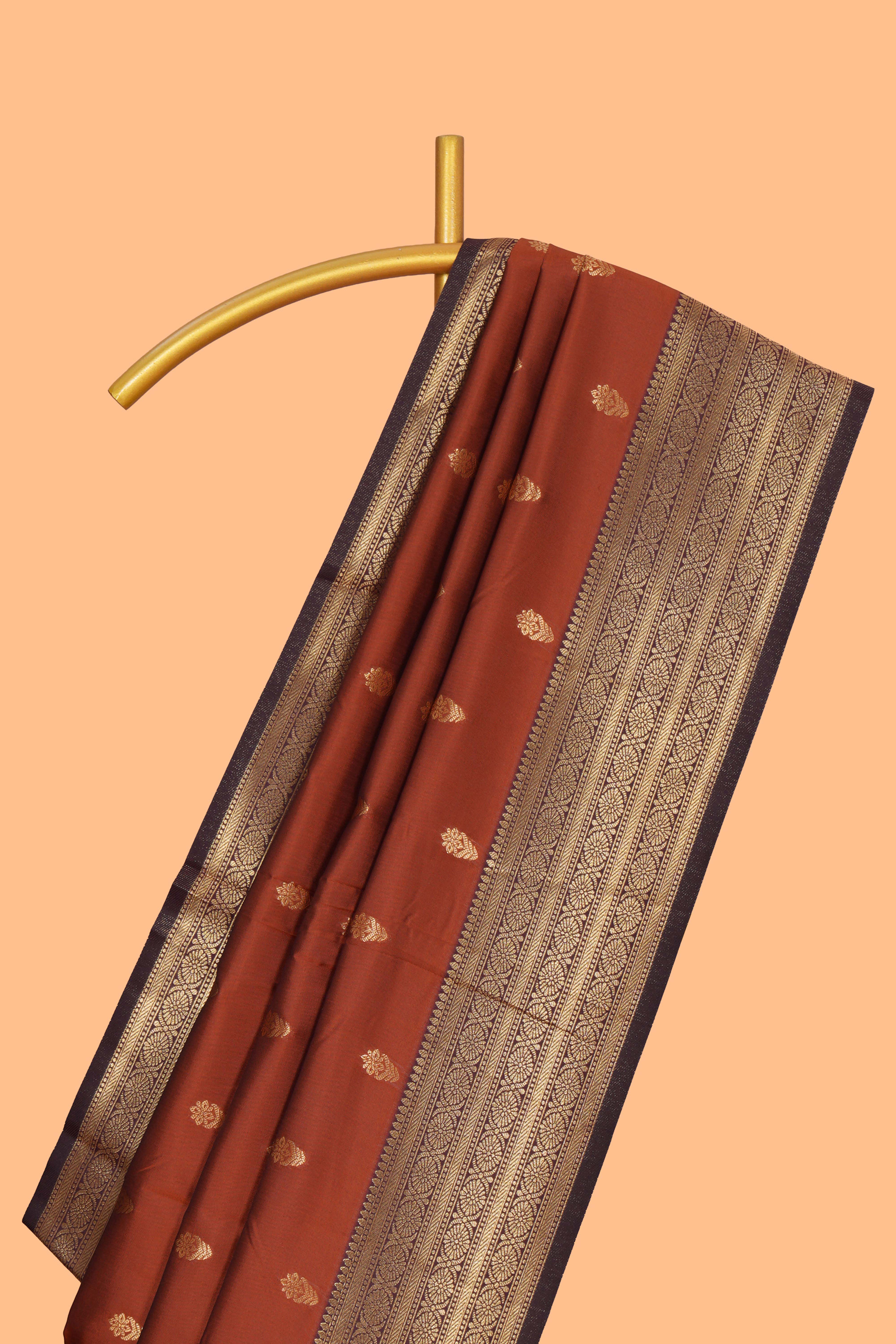 Rust orange zari motifs design semi soft silk saree with contrast border and zari blouse