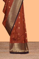 Rust orange zari motifs design semi soft silk saree with contrast border and zari blouse