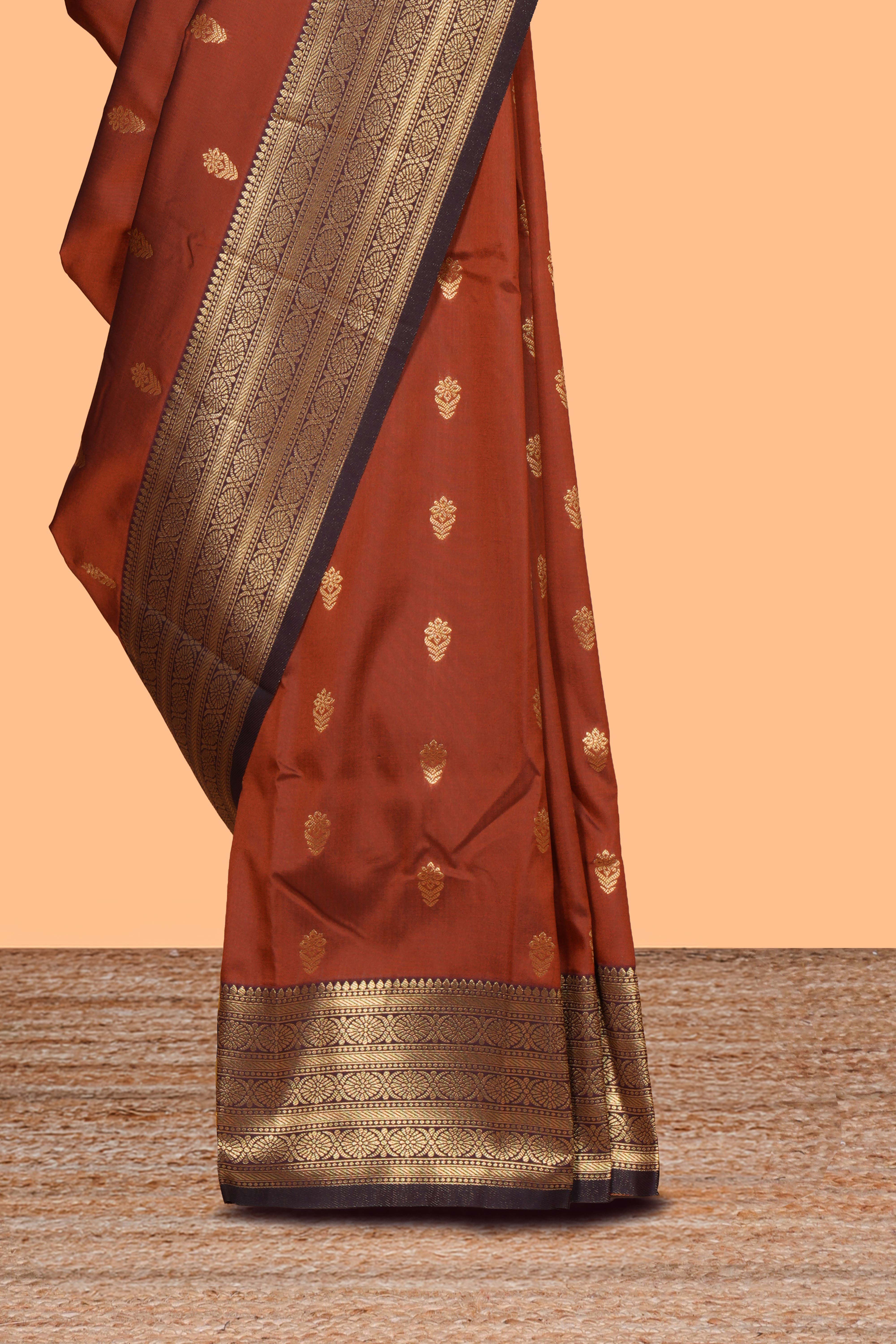 Rust orange zari motifs design semi soft silk saree with contrast border and zari blouse