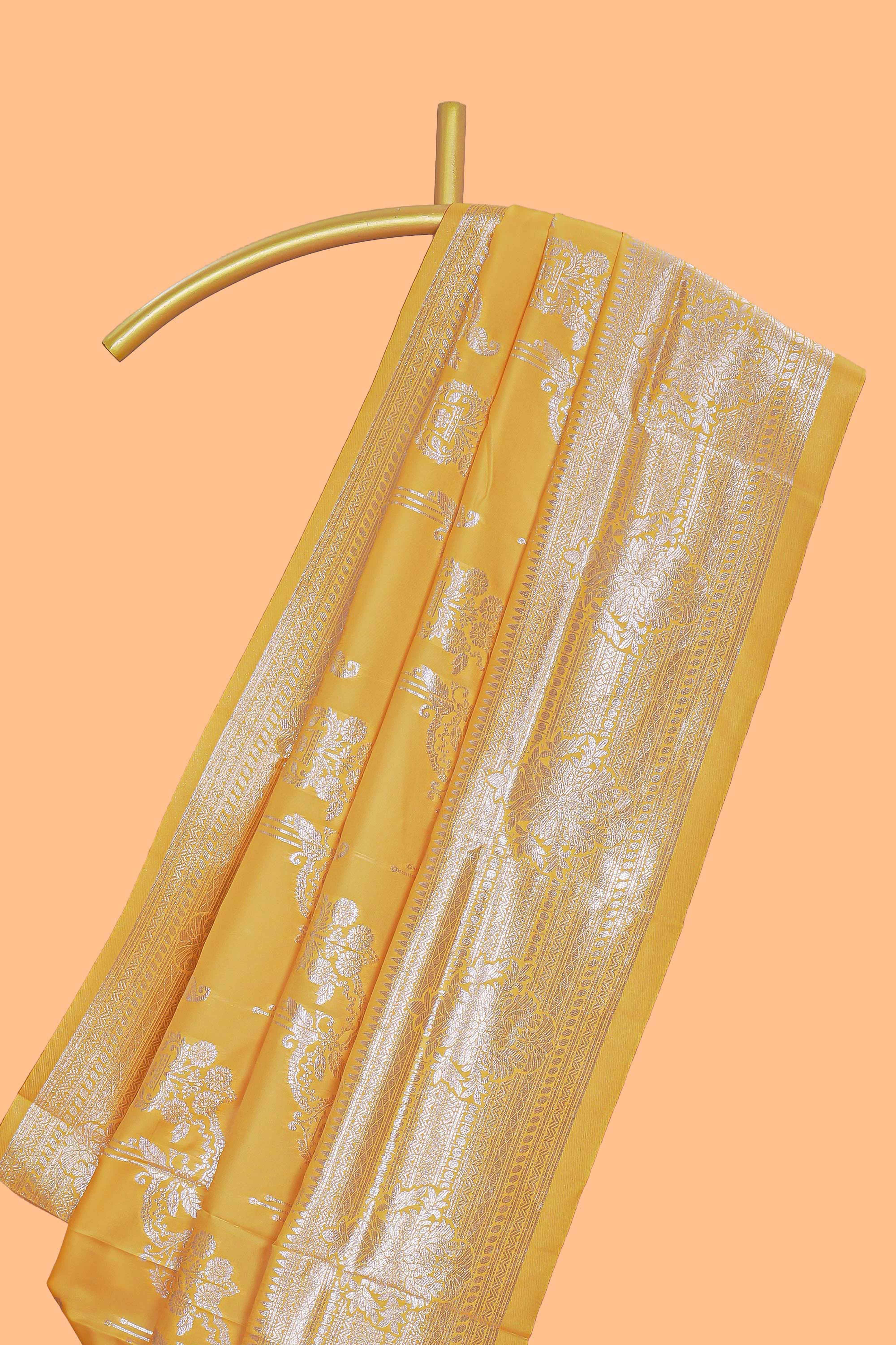Yellow zari design semi soft silk saree with self zari border and matching blouse