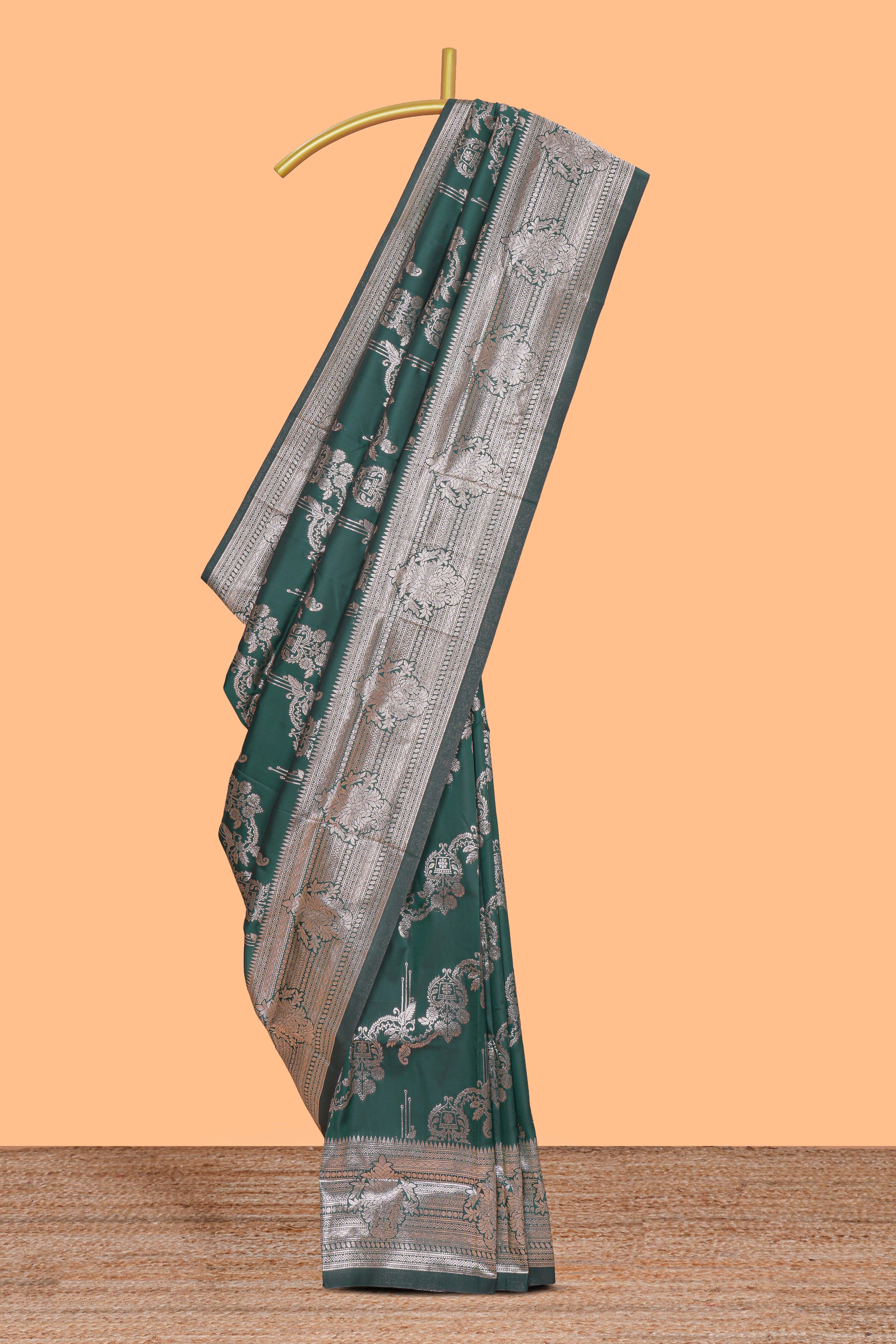 Green zari design semi soft silk saree with self zari border and matching blouse
