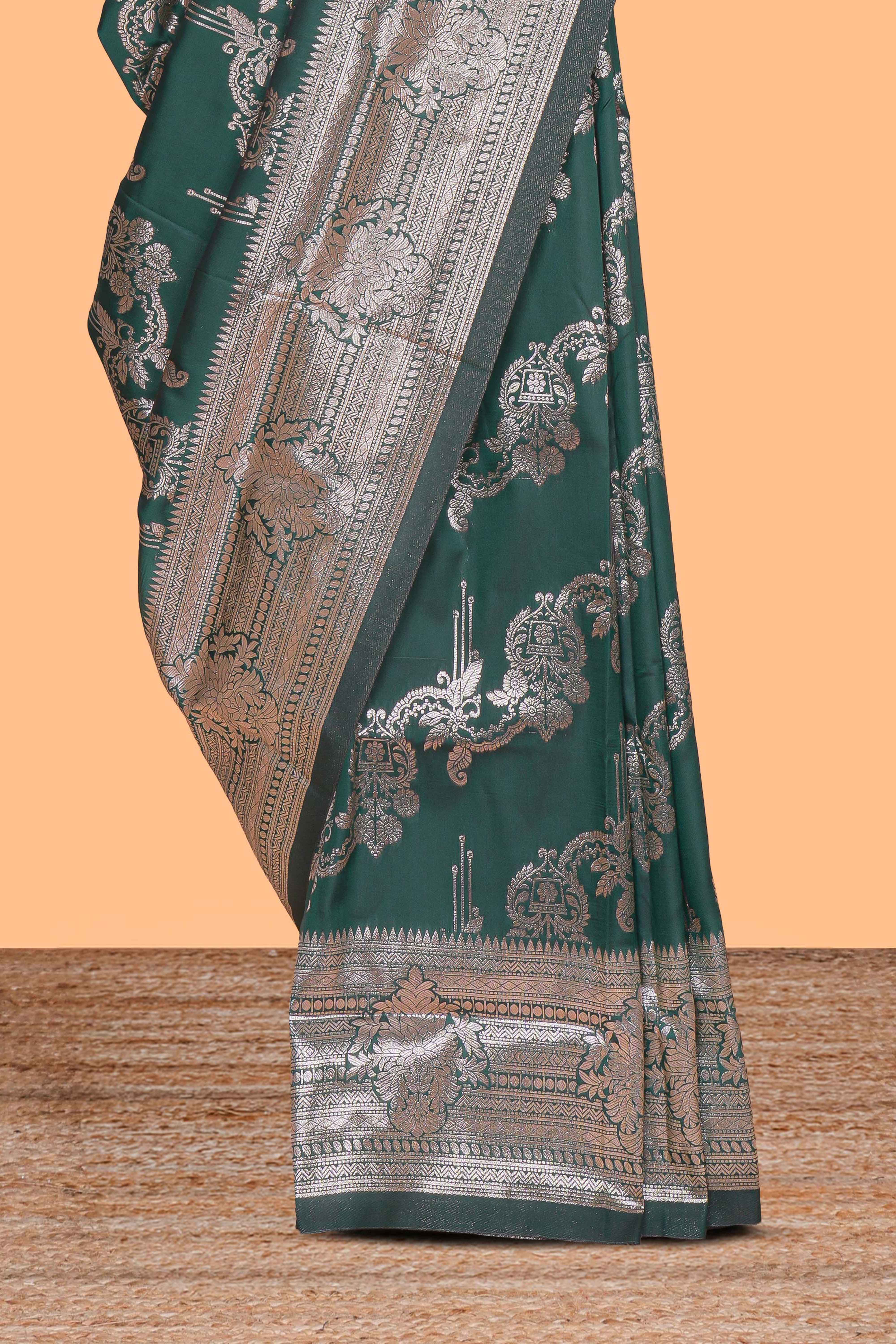 Green zari design semi soft silk saree with self zari border and matching blouse