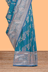 Blue zari design semi soft silk saree with self zari border and matching blouse