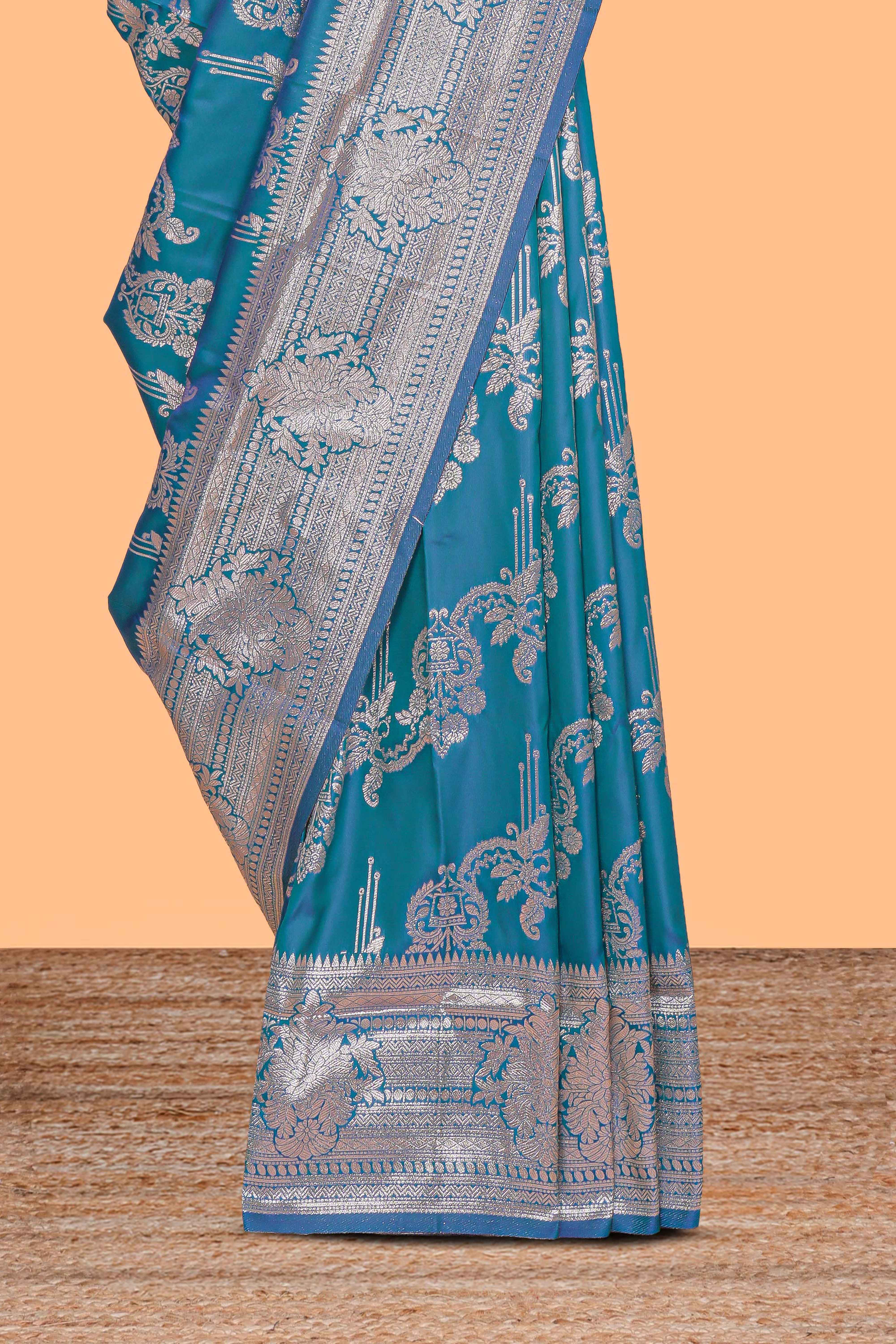 Blue zari design semi soft silk saree with self zari border and matching blouse