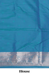 Blue zari design semi soft silk saree with self zari border and matching blouse
