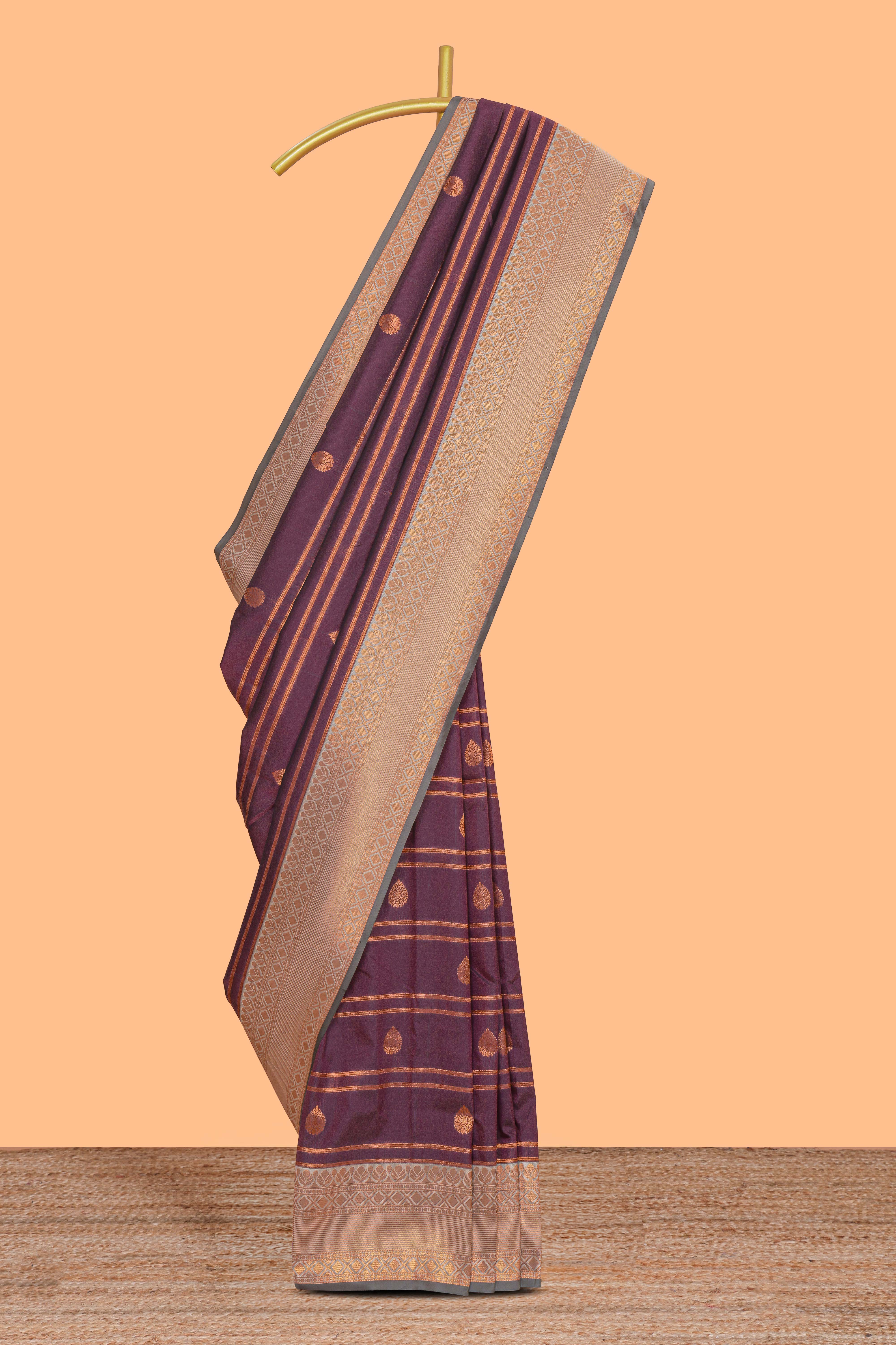 Wine purple striped motifs design semi soft silk saree with contrast border and zari motifs blouse