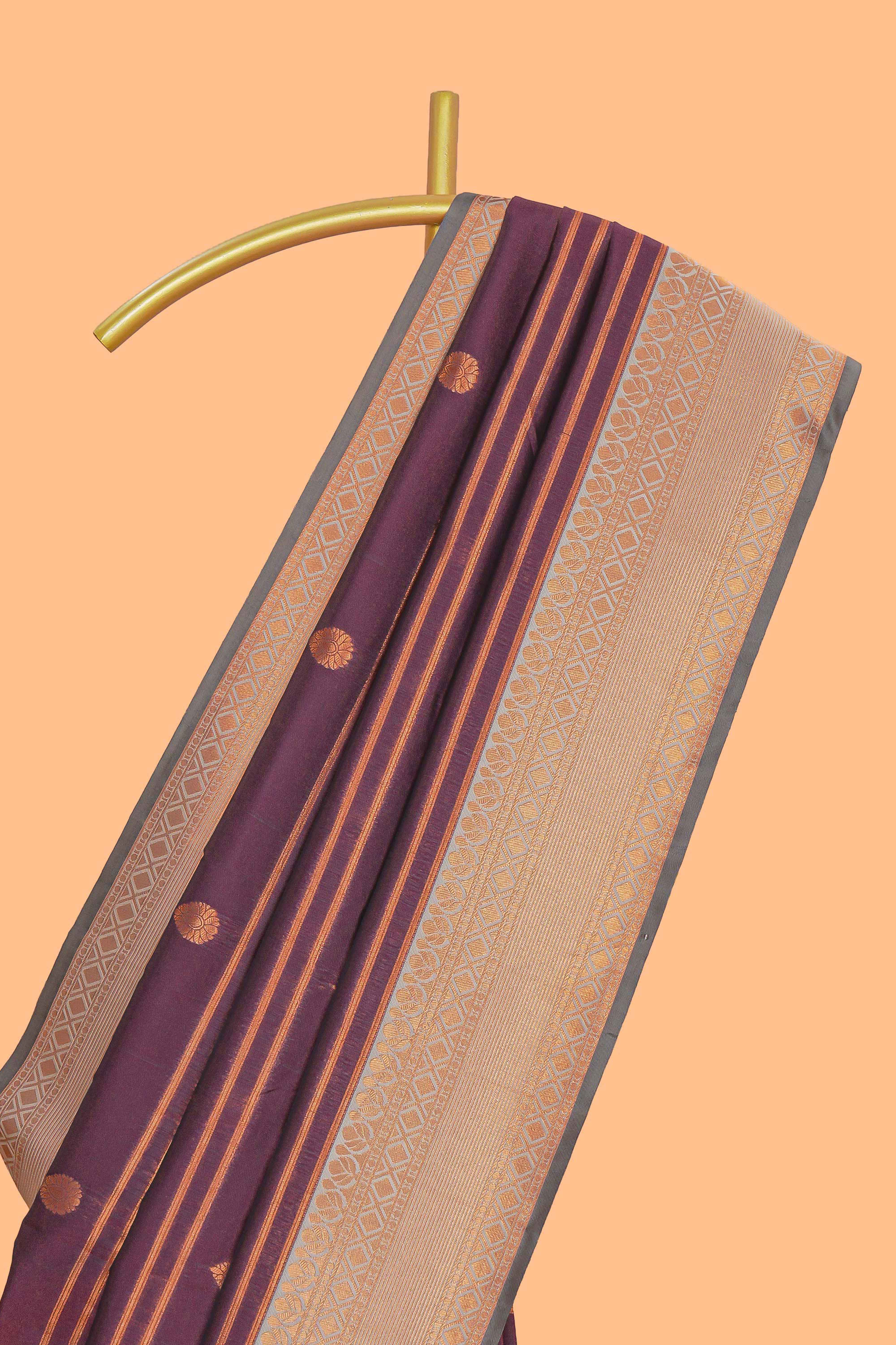 Wine purple striped motifs design semi soft silk saree with contrast border and zari motifs blouse