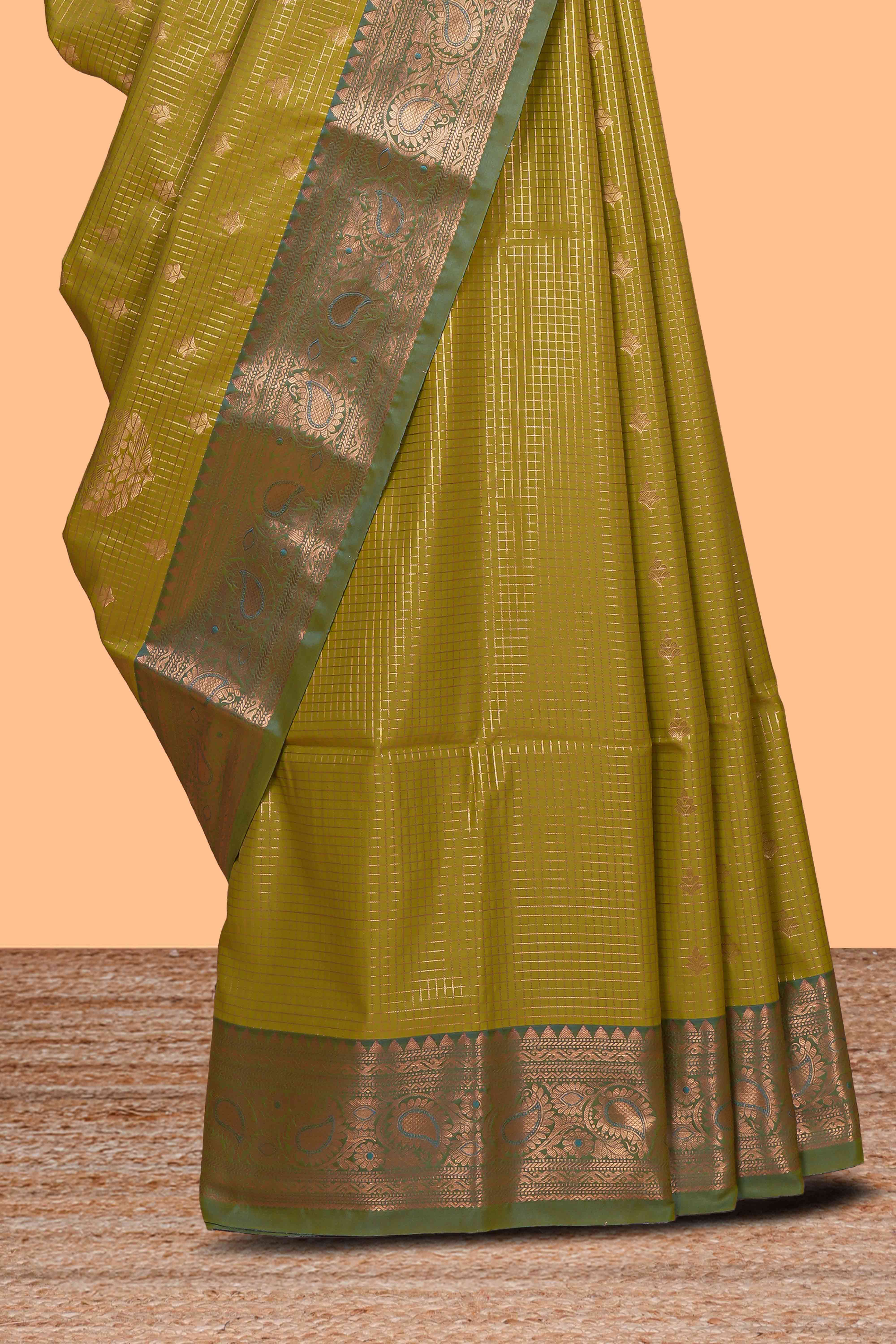 Green checked zari motifs design semi soft silk saree with contrast zari border and blouse