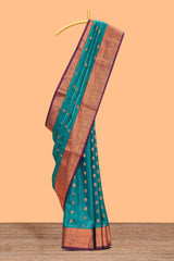 Green floral zari motifs design semi soft silk saree with contrast zari border and blouse