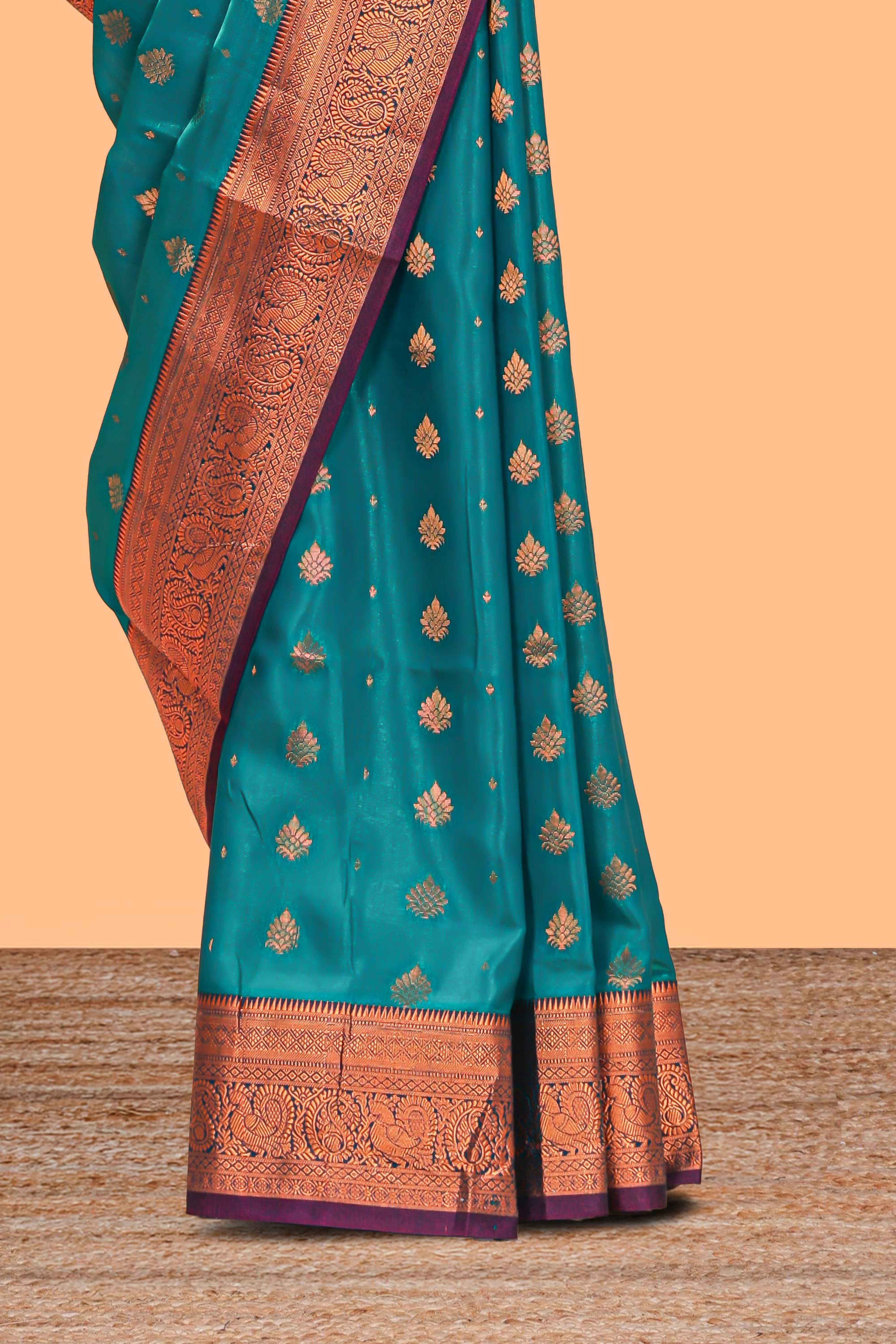 Green floral zari motifs design semi soft silk saree with contrast zari border and blouse