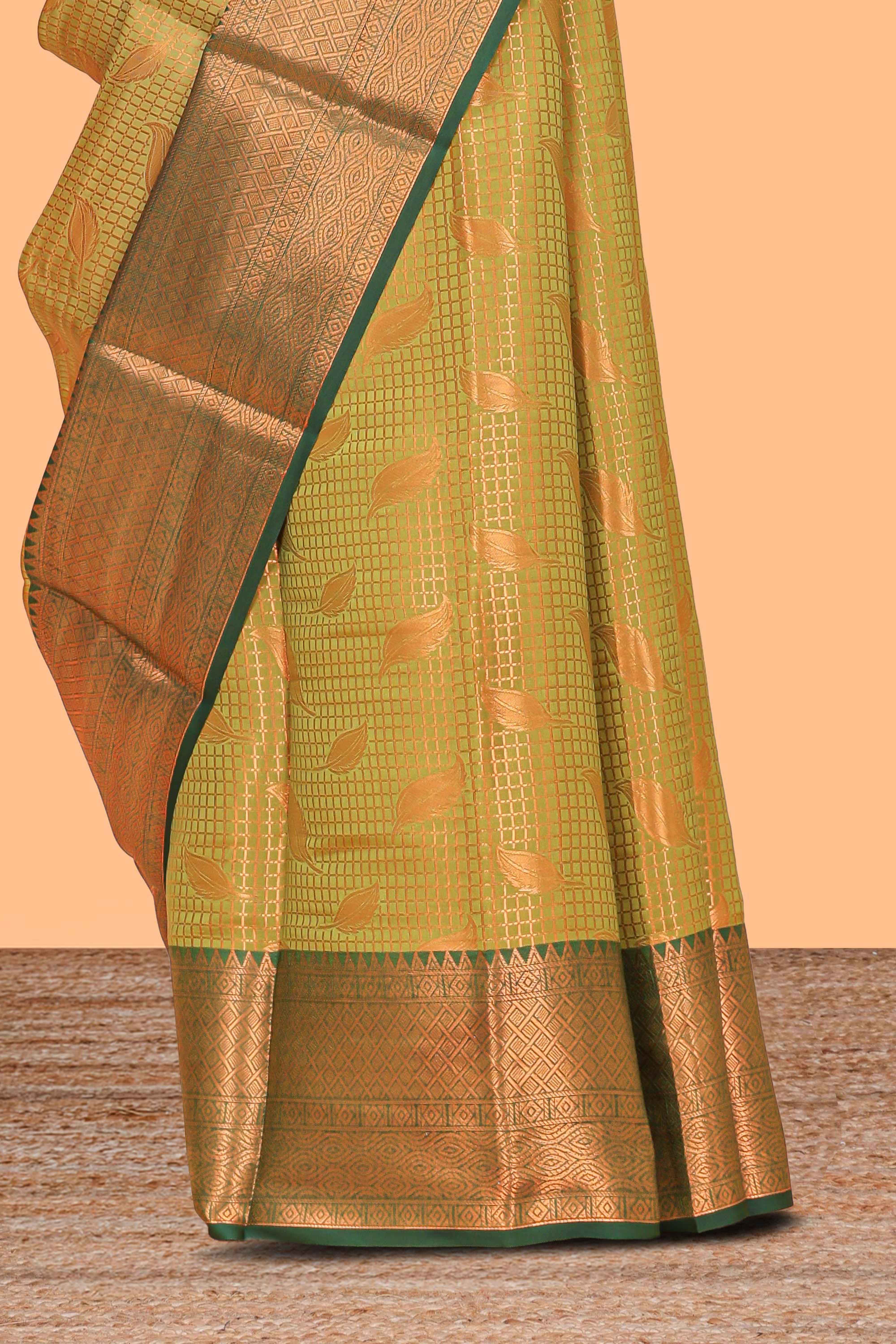Green checked zari motifs design semi soft silk saree with contrast border and zari blouse