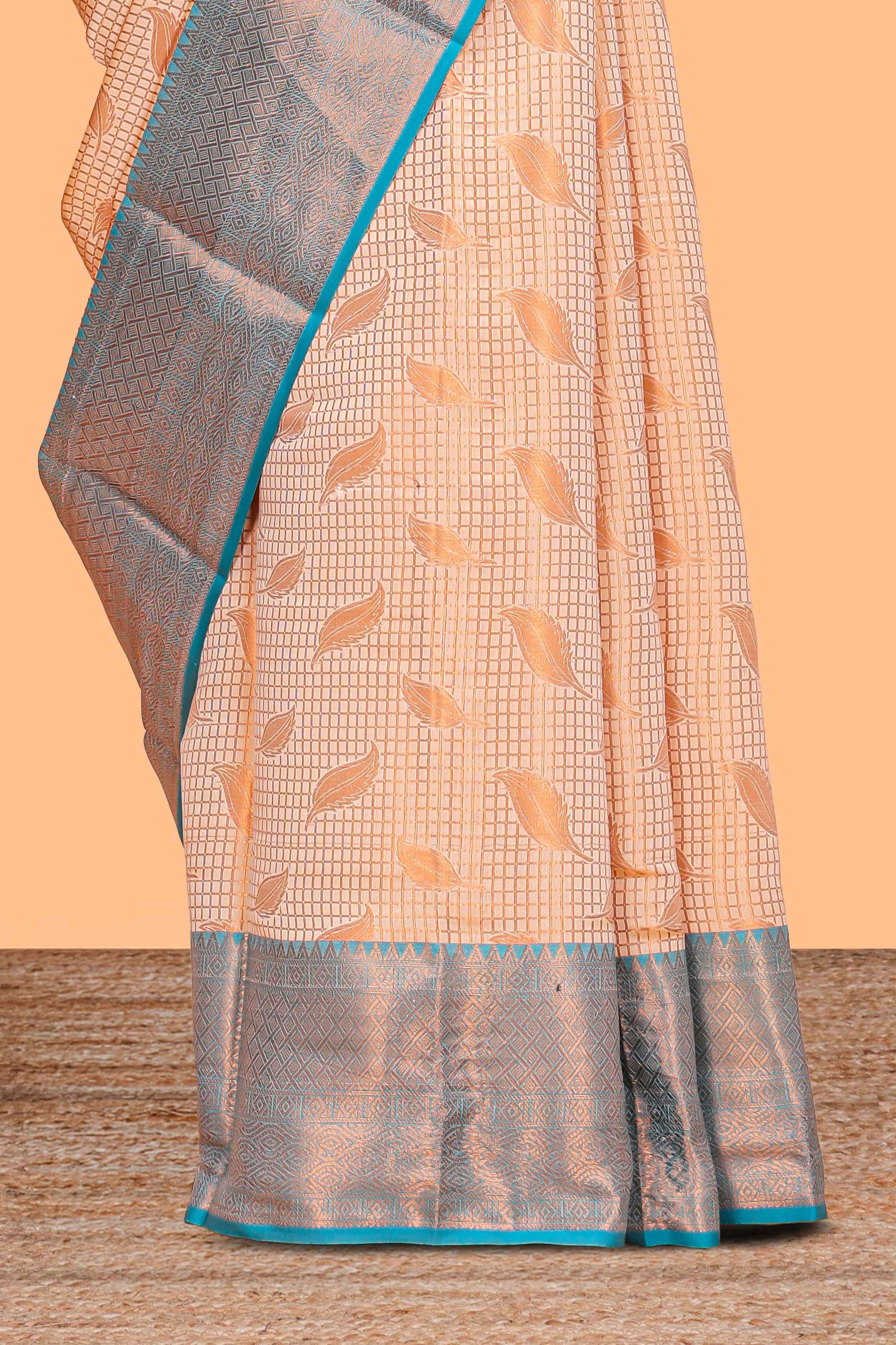 Peach checked leaf zari motifs design semi soft silk saree with contrast zari border and blouse