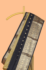 Black Semi Soft Silk Saree butta detailing rich gold zari borders traditional paisley motifs along with matching blouse