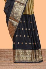 Black Semi Soft Silk Saree butta detailing rich gold zari borders traditional paisley motifs along with matching blouse