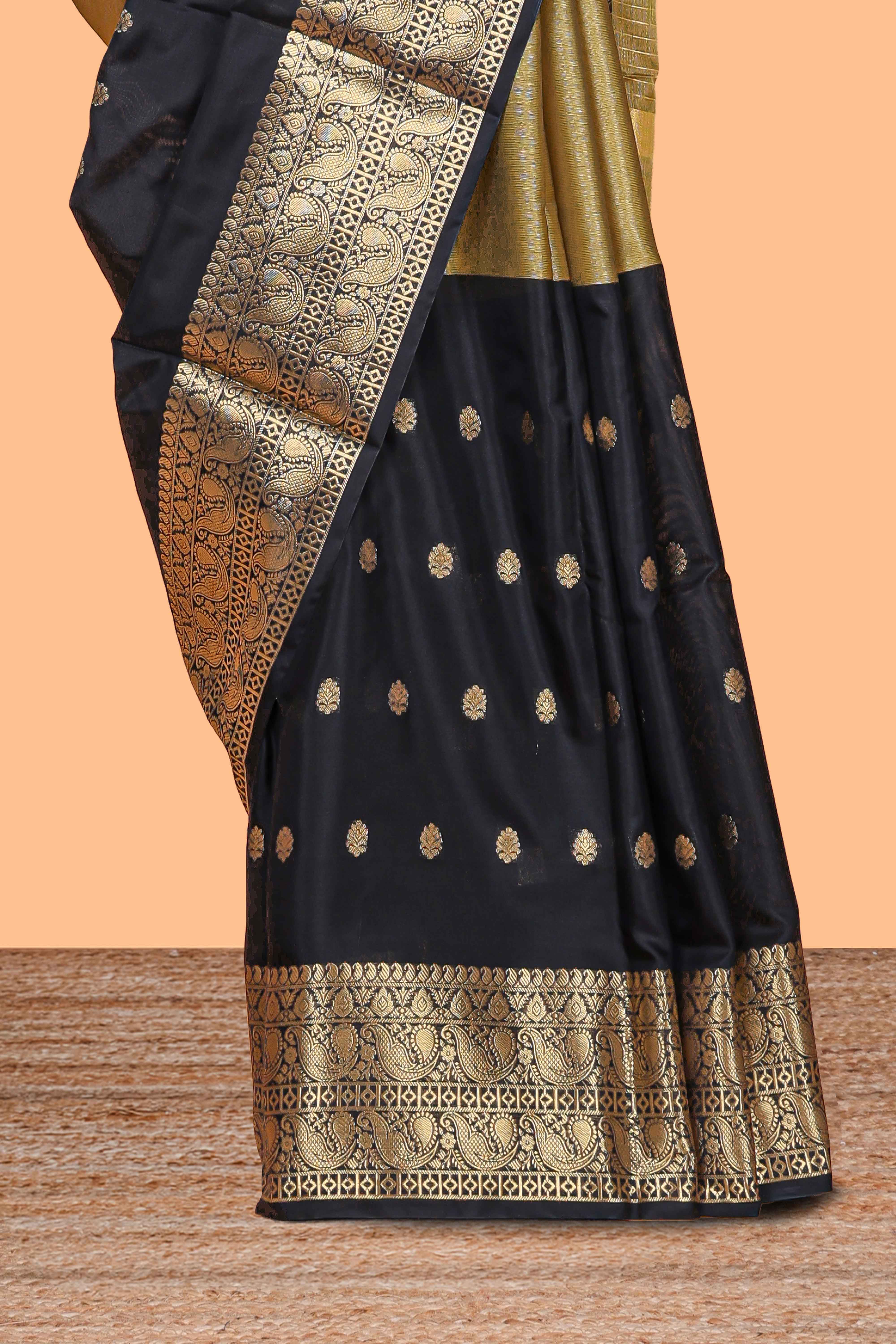 Black Semi Soft Silk Saree butta detailing rich gold zari borders traditional paisley motifs along with matching blouse