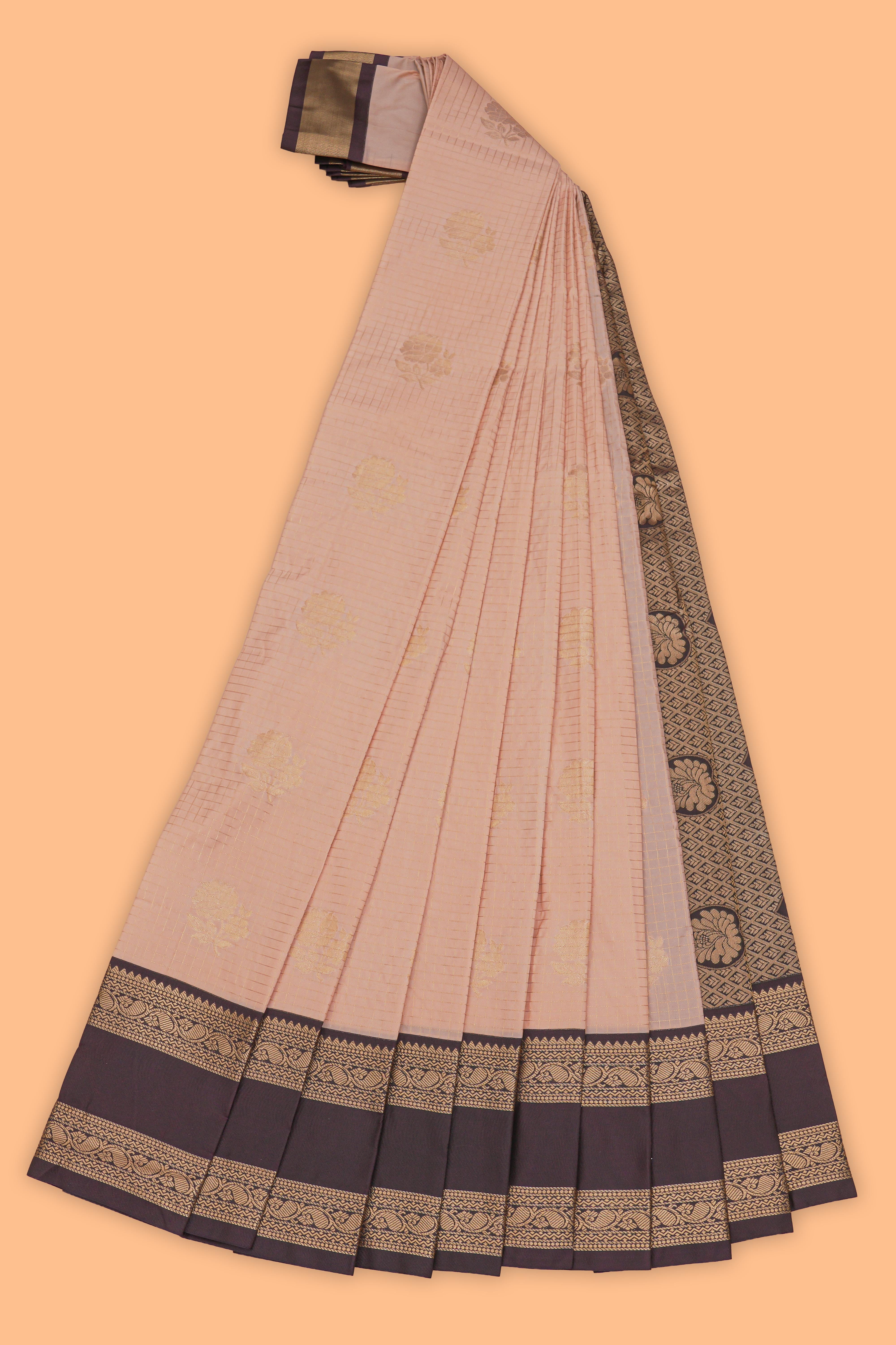 Peach checked floral zari motifs design semi soft silk saree with contrast border and zari blouse