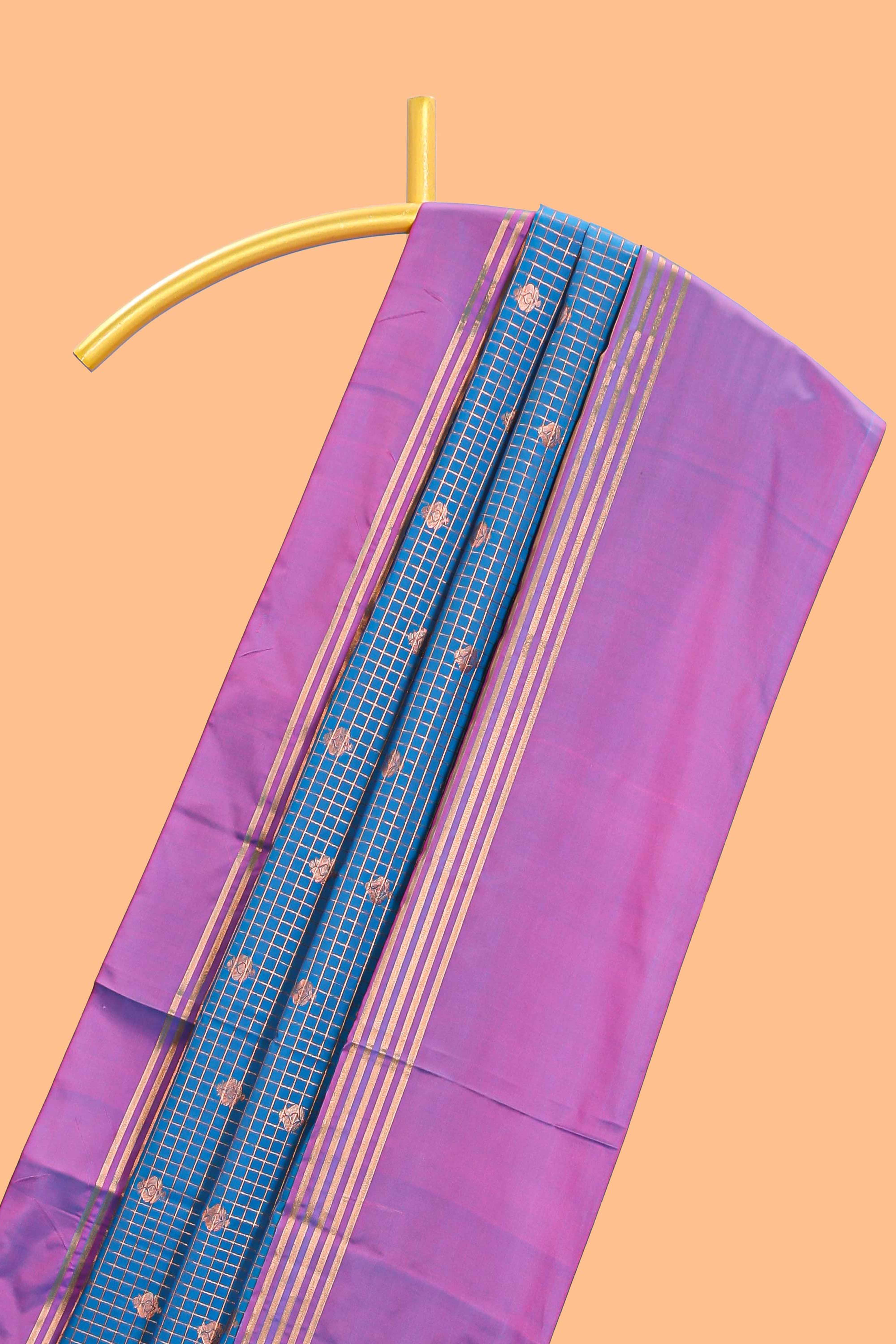 Steel blue checked floral design motifs semi soft silk saree with contrast border and blouse
