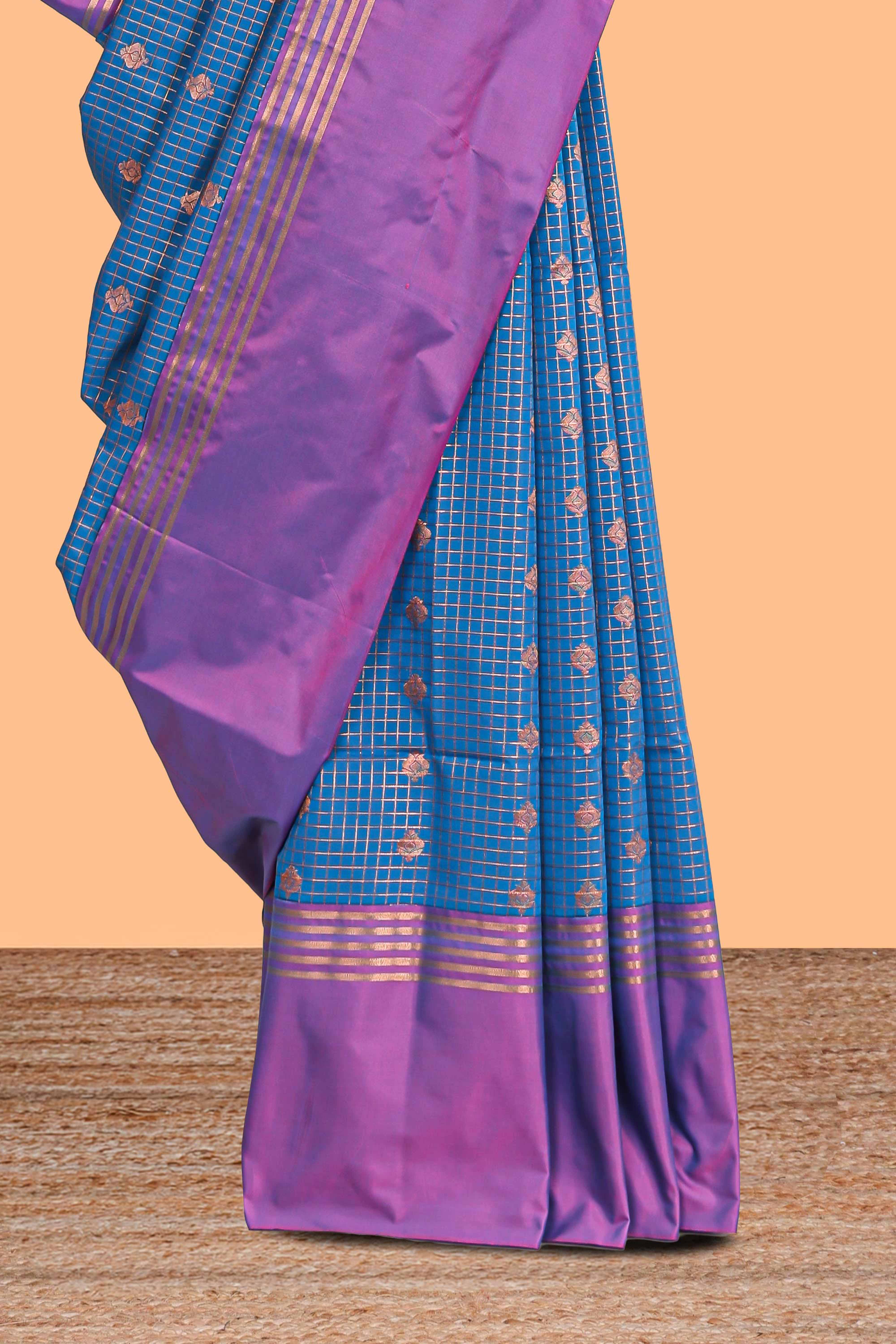 Steel blue checked floral design motifs semi soft silk saree with contrast border and blouse