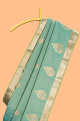 Green floral design motifs semi soft silk saree with self border and contrast blouse