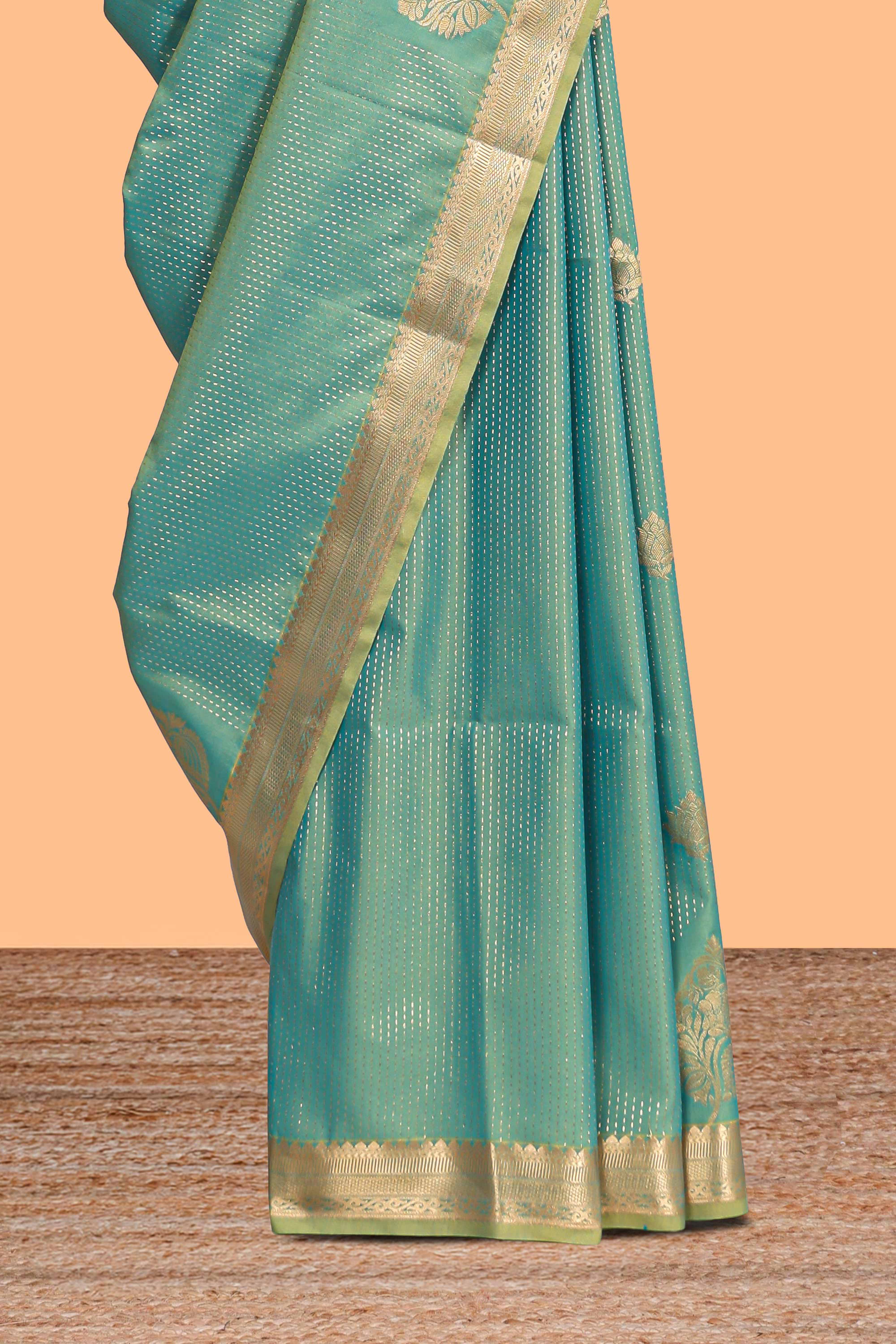 Green floral design motifs semi soft silk saree with self border and contrast blouse