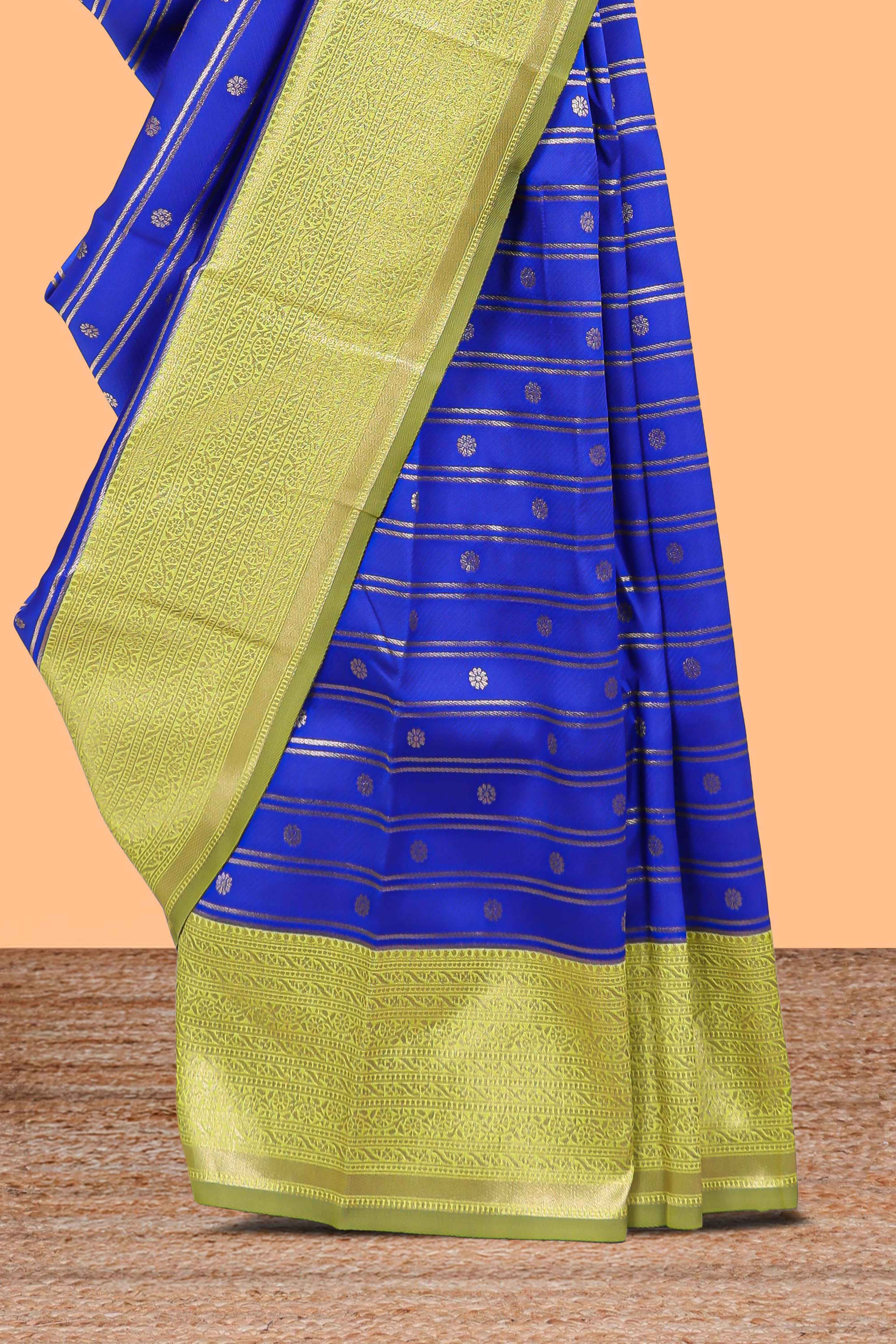 Blule striped and butta detailed Semi Soft Silk Saree with contrast zari border along with contrasting blouse