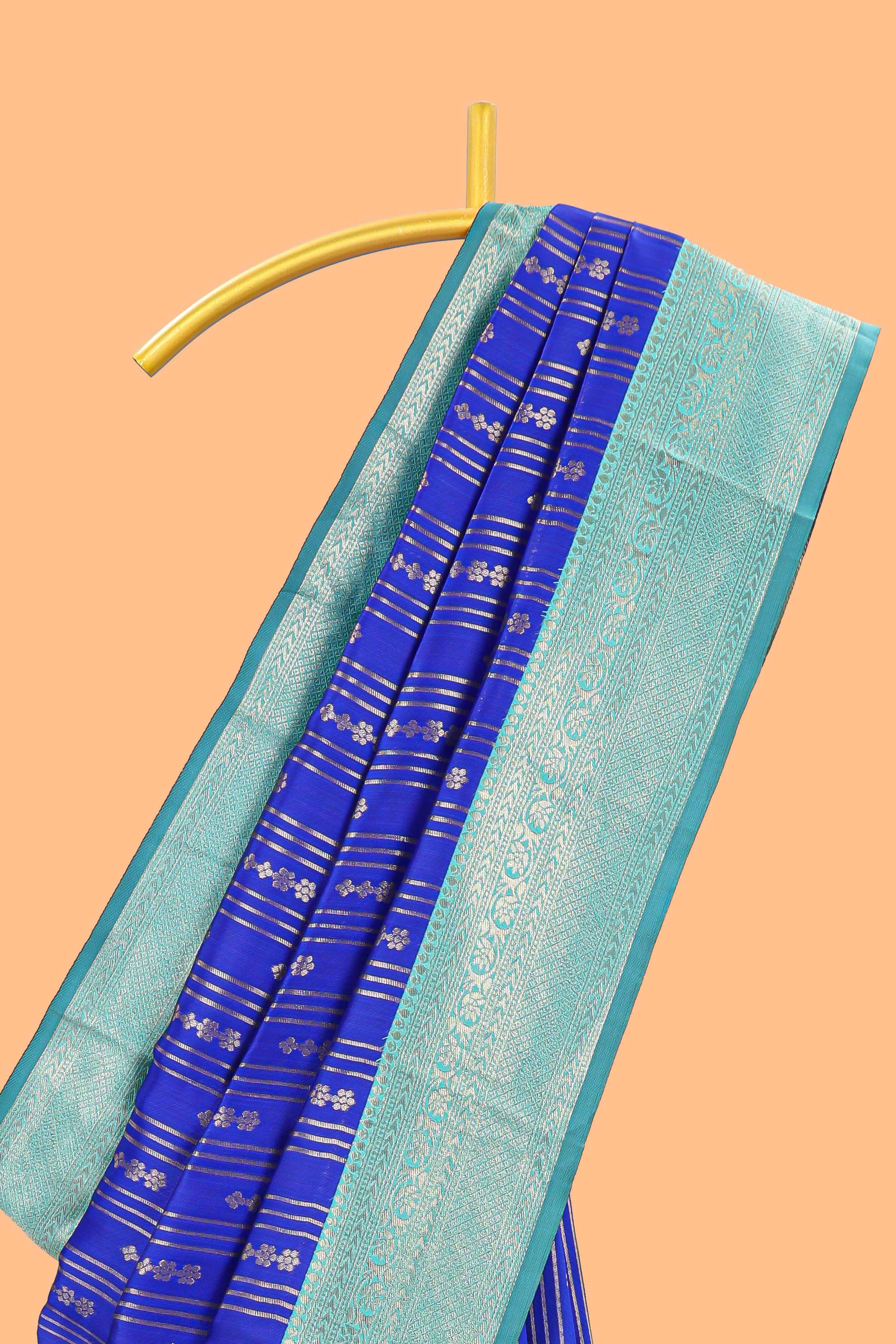 Blule striped and butta detailed Semi Soft Silk Saree with contrast teal blue zari border along with contrasting blouse