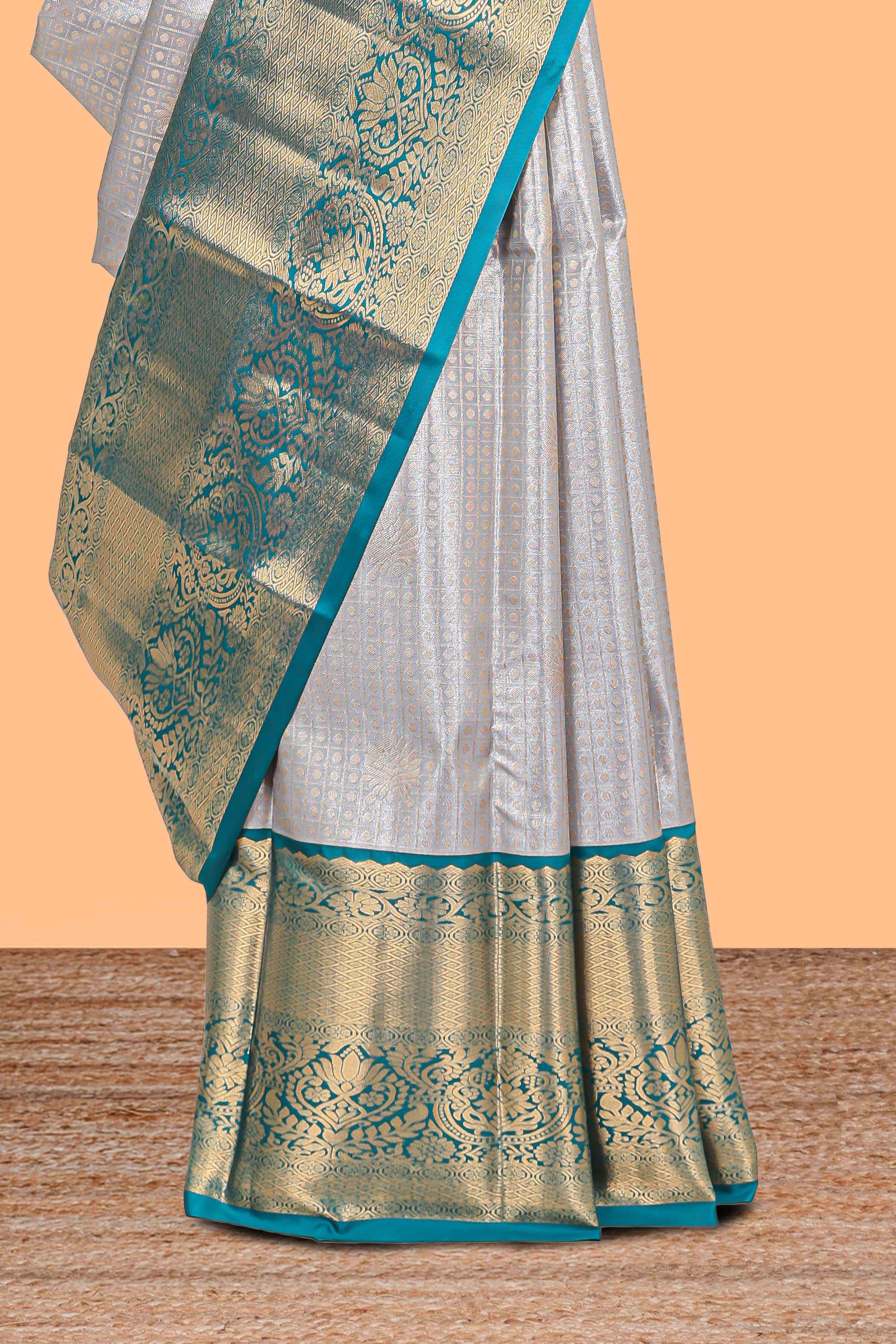 Grey shade checked butta design Semi Soft Silk Saree with pink contrast zari border along with contrasting blouse