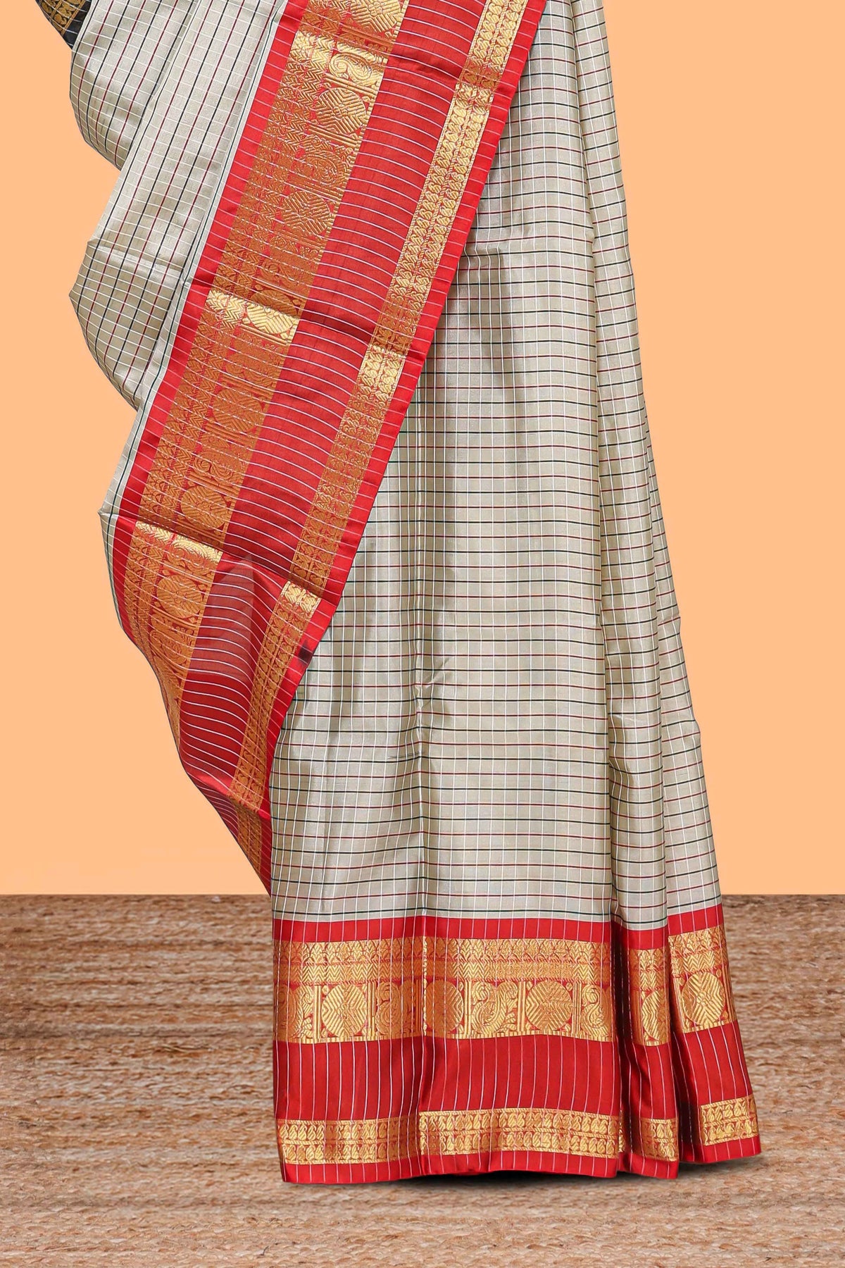 Silver checked semi soft silk saree with contrast zari border and matching striped blouse