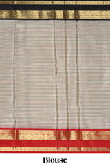 Silver checked semi soft silk saree with contrast zari border and matching striped blouse