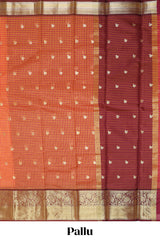 Orange and pink checked zari motifs semi soft silk saree with contrast zari border and motifs blouse