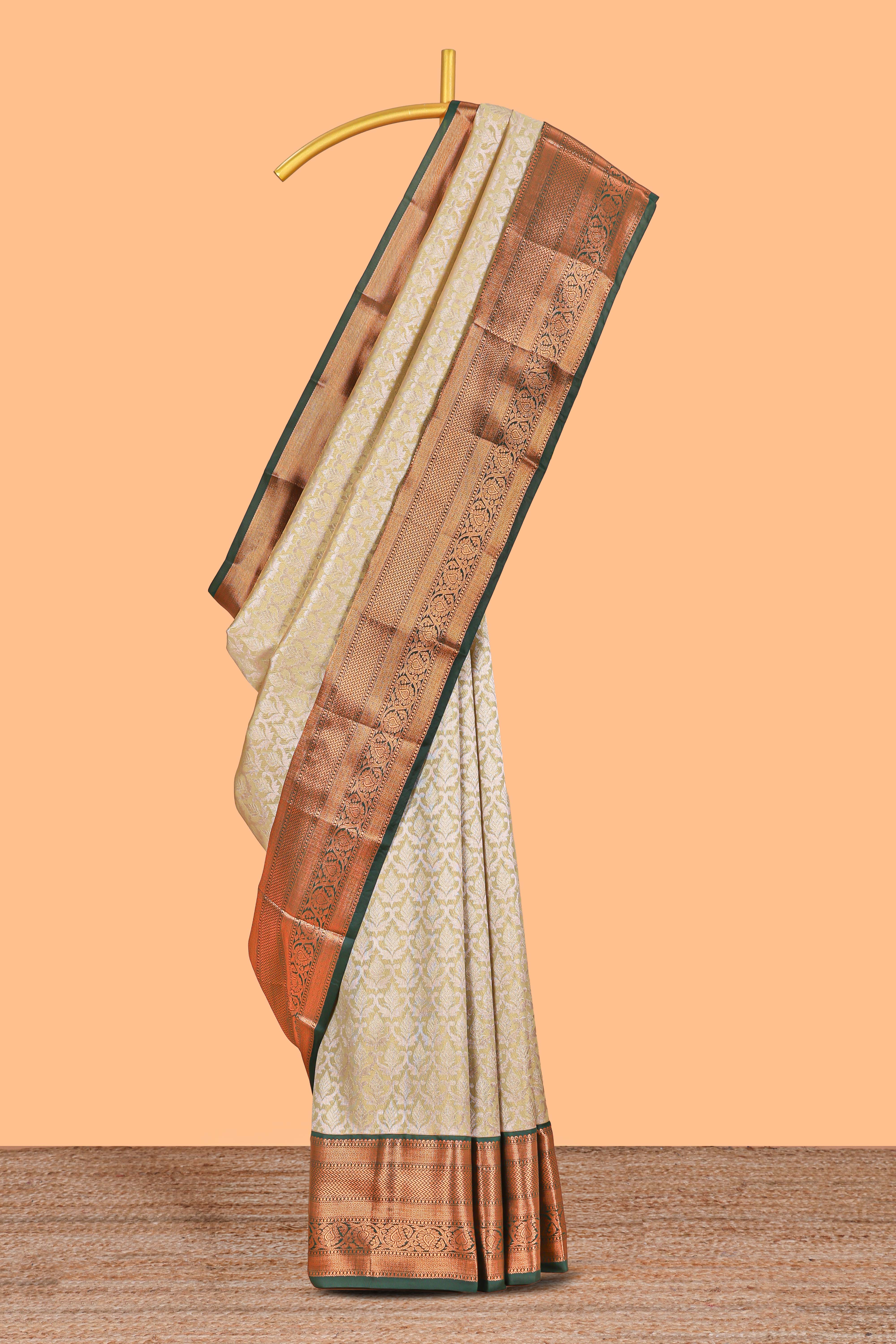 Powder Yellow Tissue Silk Saree with Antique Gold Zari Weaving and Contrast Border along with Contrast Blouse