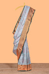 Pastel Aqua Blue Tissue Silk Saree with Antique Gold Zari Weaving and Contrast Dark Green Border along with Matching Blouse