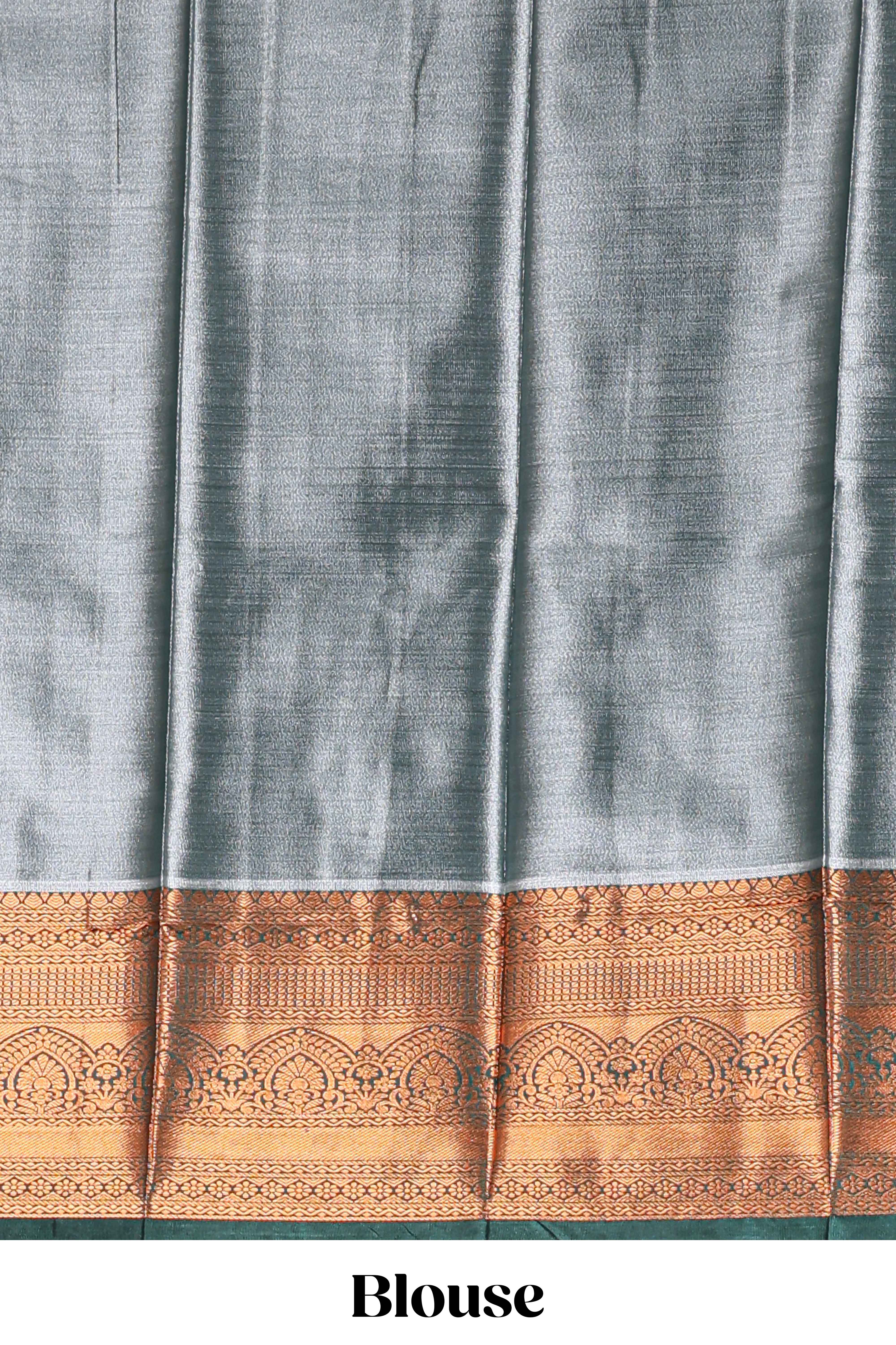 Pastel Aqua Blue Tissue Silk Saree with Antique Gold Zari Weaving and Contrast Dark Green Border along with Matching Blouse