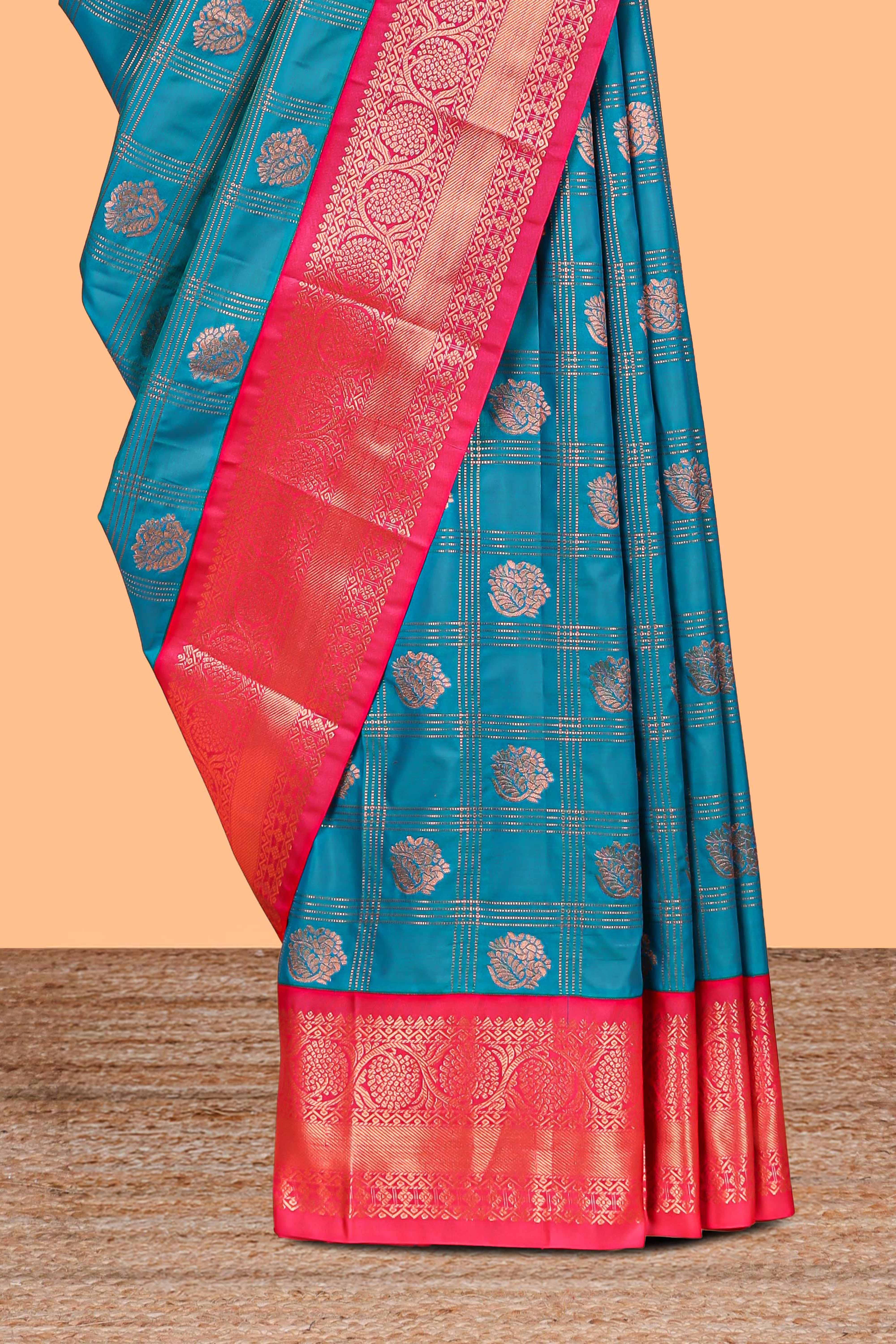Blue Color Tissue Silk Saree withZari Checksand Buttas Weaving Body and Contrast Border along with Contrast Blouse