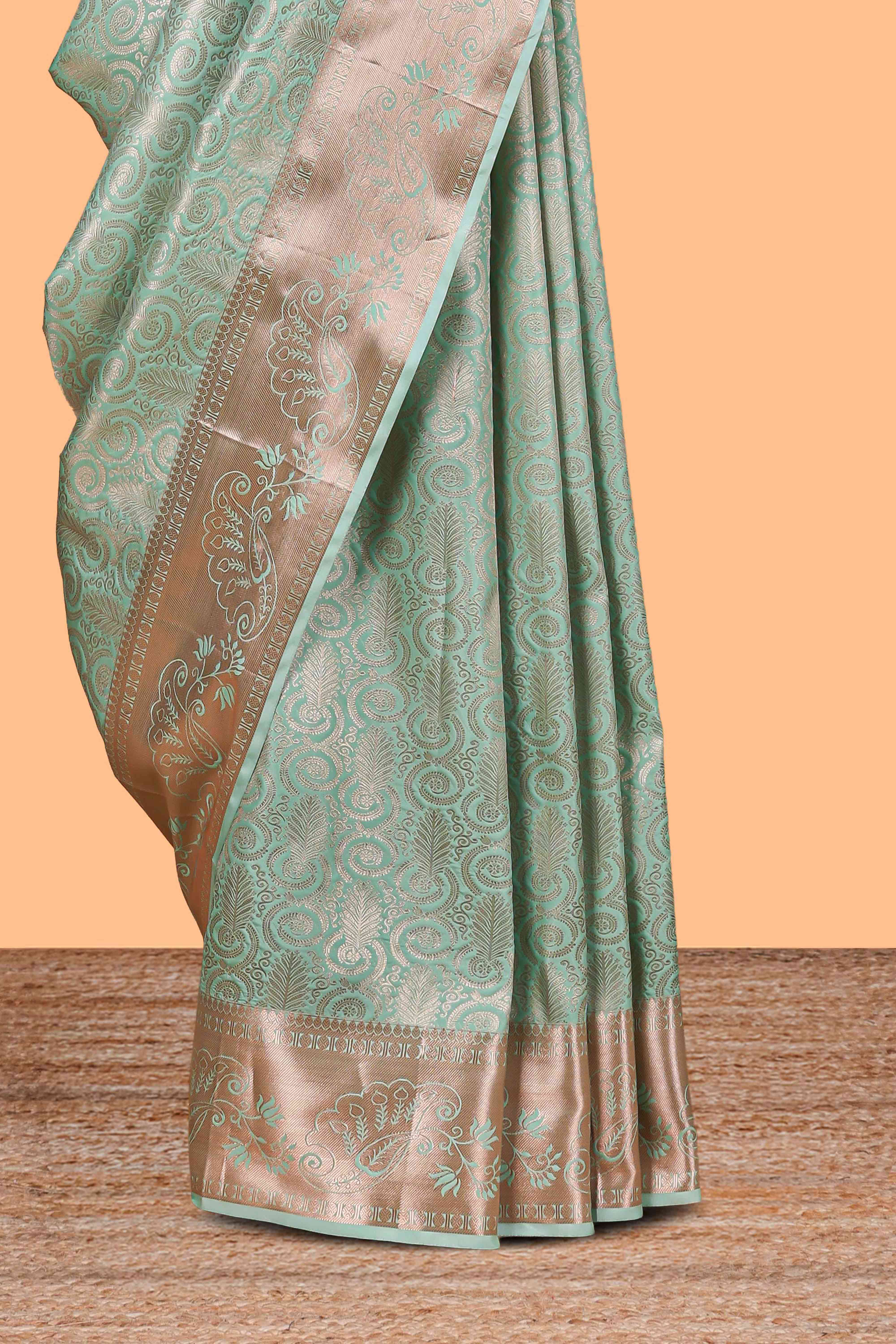 Pastel Green Color Tissue Silk Saree withZari Weaving Body and Contrast Border along with Matching Blouse