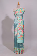 Blue geometric design tissue saree with contrast floral print border and printed blouse