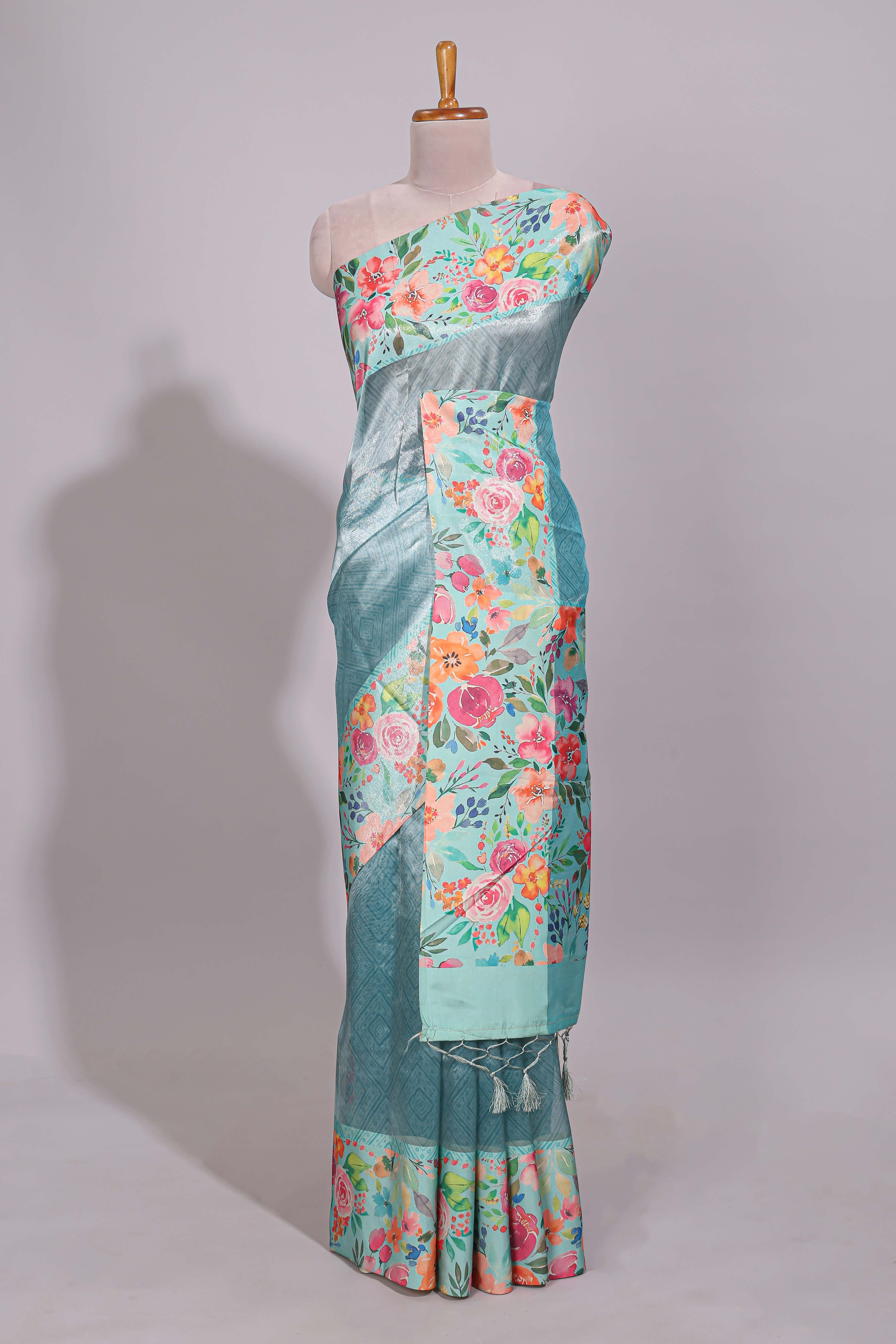 Blue geometric design tissue saree with contrast floral print border and printed blouse