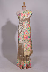 Brown geometric design tissue saree with contrast floral print border and printed blouse