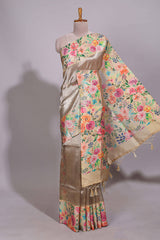Brown geometric design tissue saree with contrast floral print border and printed blouse