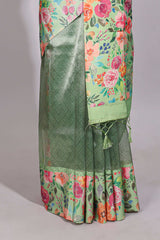 Green geometric design tissue saree with contrast floral print border and printed blouse