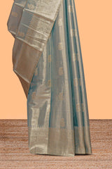 Steel blue zari floral design tissue saree with self zari border and matching blouse
