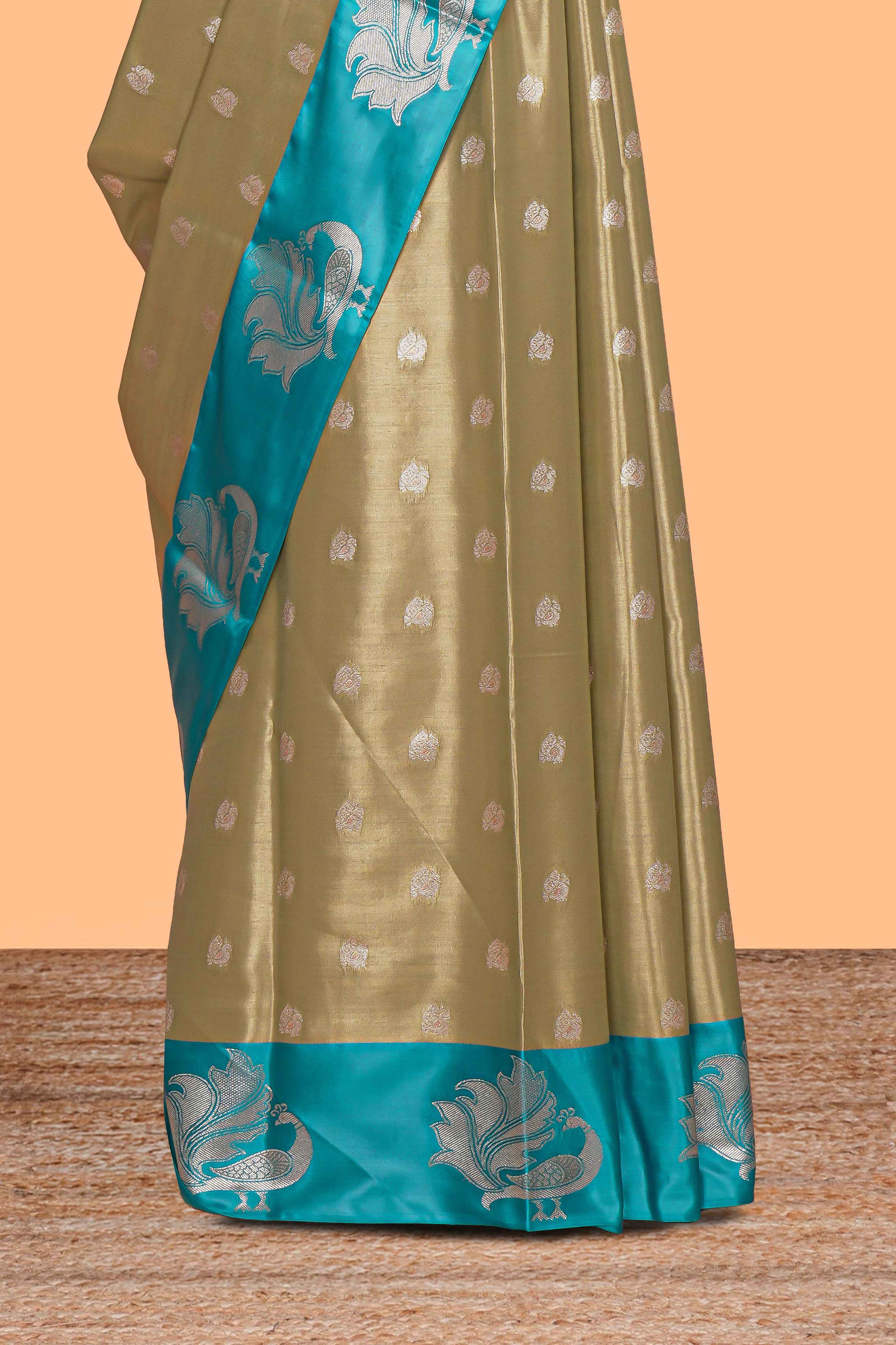 Mustard zari motifs design tissue saree with contrast peacock zari border and motifs blouse