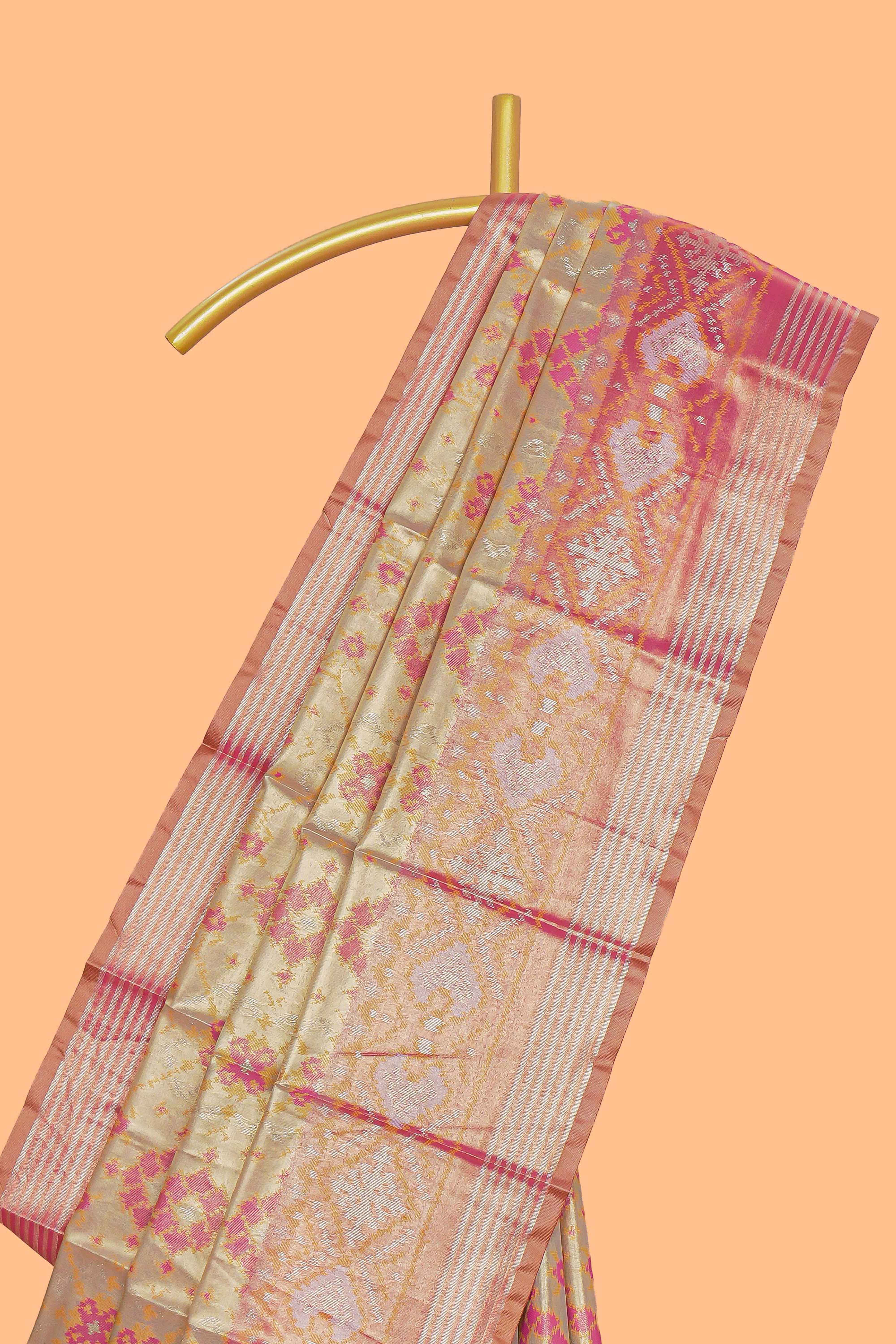 Gold floral design tissue saree with contrast zari border and motifs blouse