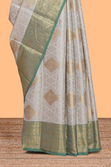 Grey zari motifs design tissue saree with contrast zari border and zari blouse