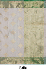 Grey zari motifs design tissue saree with contrast zari border and zari blouse