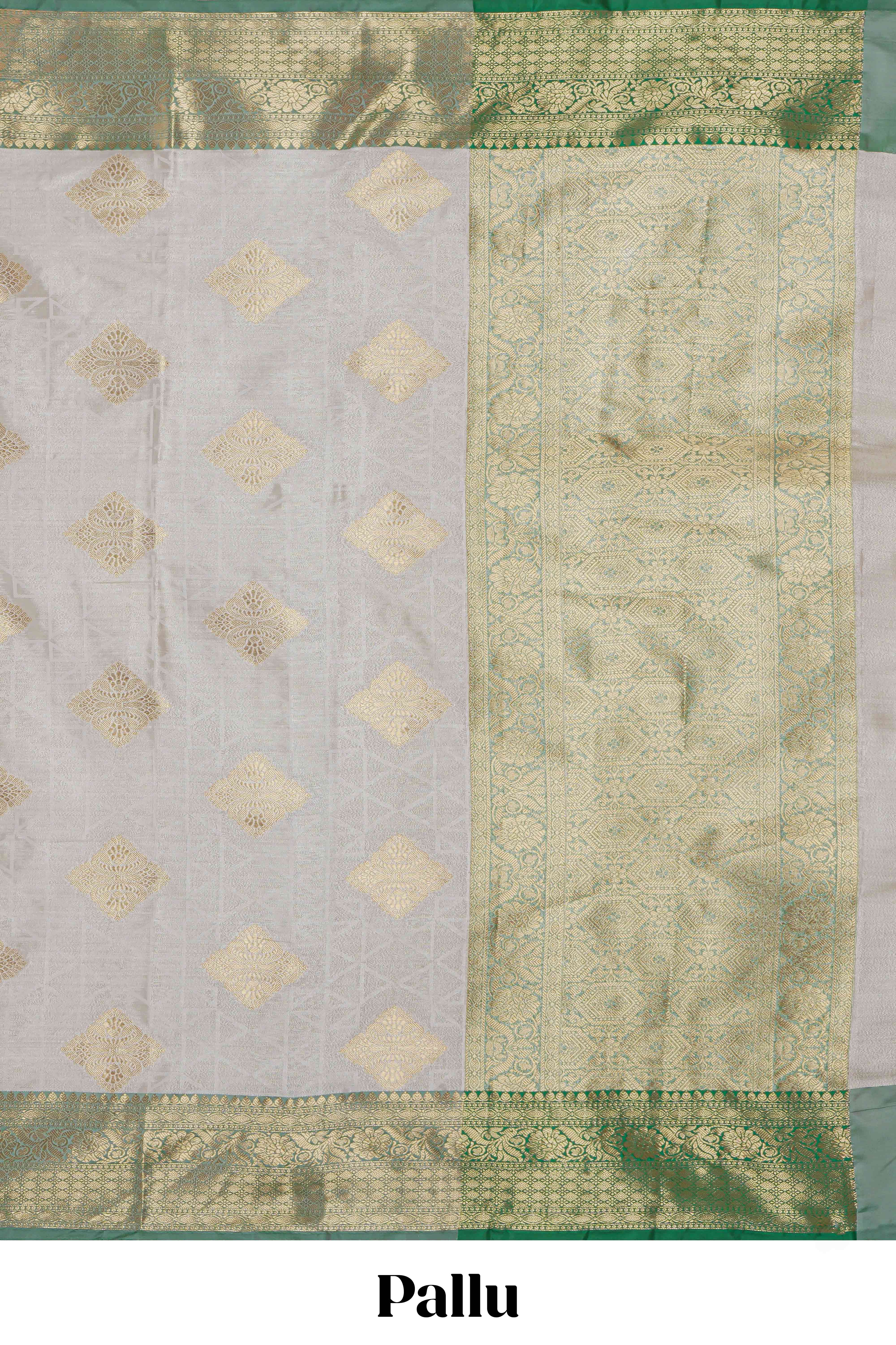 Grey zari motifs design tissue saree with contrast zari border and zari blouse