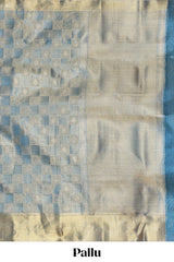 Blue checked zari motifs art tissue saree with self zari border and matching blouse