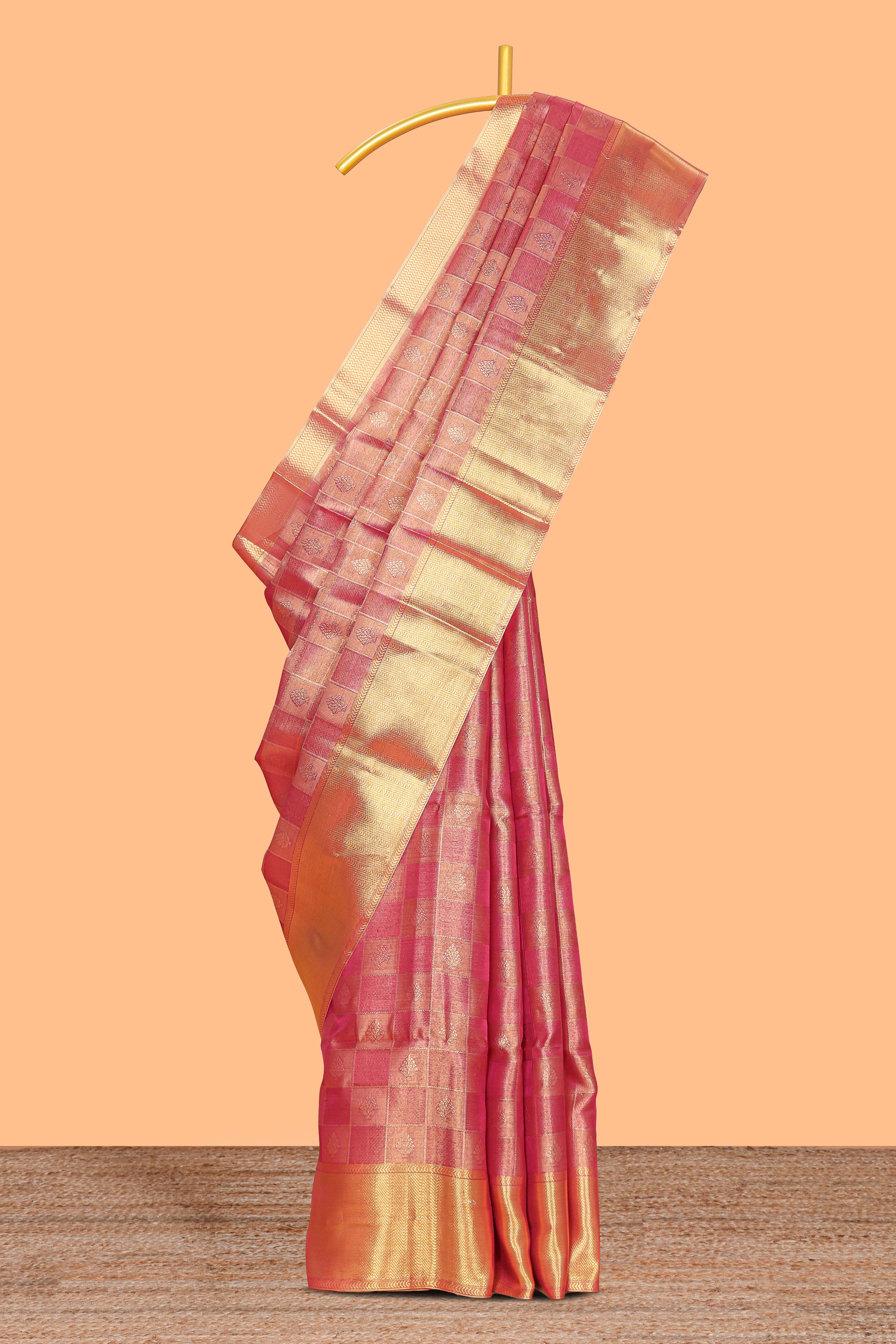Pink checked zari motifs art tissue saree with self zari border and matching blouse